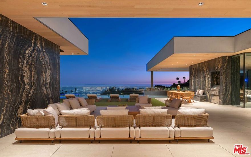 Discover an extraordinary estate that redefines luxury living, where breathtaking views and masterful design by Paul McClean create a serene sanctuary. This stunning residence blends sophistication and comfort, providing an enchanting backdrop for entertaining and relaxation. Expansive living and dining areas seamlessly connect to beautiful outdoor spaces, inviting nature indoors. Cozy up in the family room or enjoy cinematic experiences in the state-of-the-art home theater. The refined bar, with temperature-controlled wine storage, sets the stage for memorable gatherings. Prioritize wellness with a dedicated gym, cold plunge pool, dry sauna, and massage room. Outside, the lavish pool and spa invite serene afternoons amidst beautifully landscaped grounds. This exceptional estate features unique multi-level street access, seamlessly connecting to two distinct streets for added convenience and versatility. Crafted from the finest materials, this estate embodies timeless elegance and enduring quality. Embrace a lifestyle of luxury and tranquility.