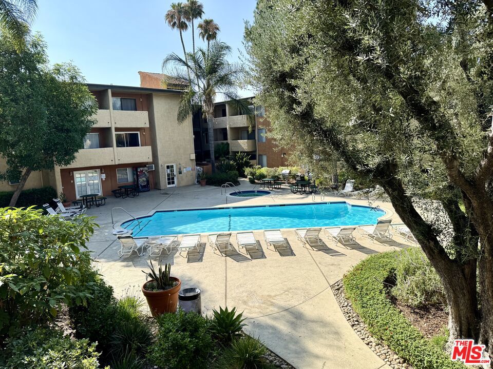 This updated one-bedroom condo in the heart of Van Nuys is ready for new tenants. The unit features wood laminate floors throughout and freshly painted walls, giving it a clean, updated feel. The kitchen features new countertops, and there's plenty of storage with tall mirrored closets that help make the space feel bigger. The large balcony overlooks mature trees and offers a pleasant view of the community pool below. The complex itself is well-kept with landscaped grounds, three fountains, a good-sized swimming pool, spa, and fitness room. You'll get two parking spaces with the unit. It's centrally located in Van Nuys with easy access to shopping and freeways, but the community feels quiet and residential. The condo is move-in ready and offers a comfortable living space with nice amenities.