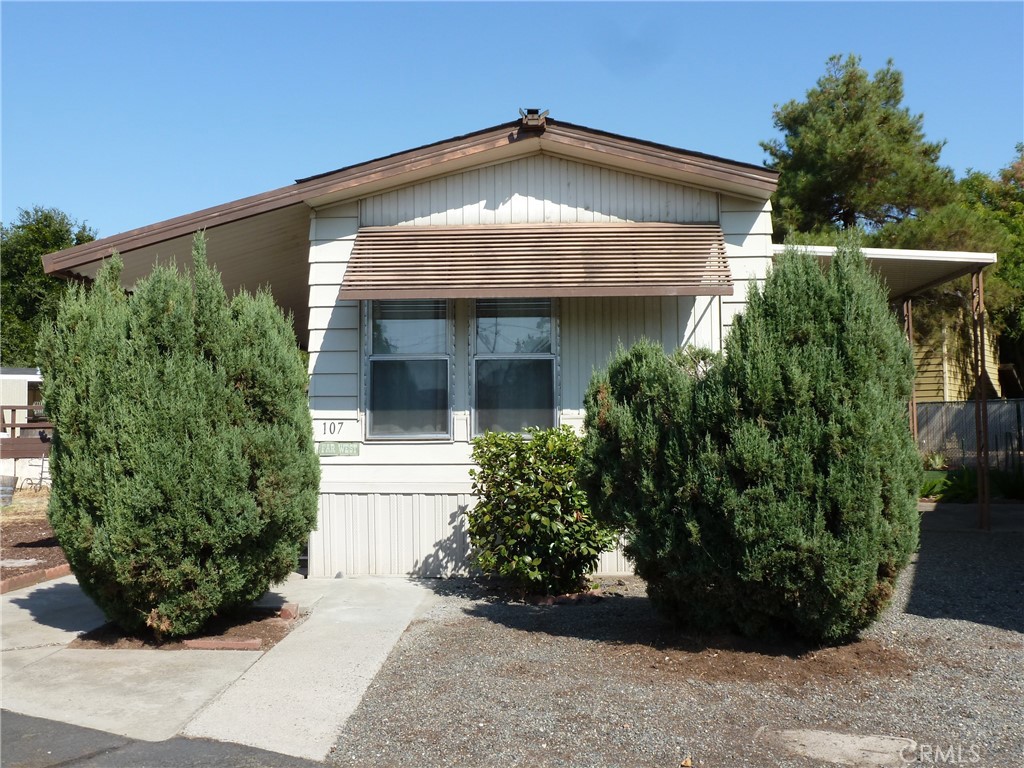 JUST RIGHT describes this 2 bedroom home in Cottonwood Estates, a Senior Park for those 55 and older. Located in downtown Oroville, the park is close to stores, parks, restaurants, medical facilities, and public transportation. There is a cheery, eat-in kitchen with large windows, new appliances, and new vinyl flooring. The adjacent living room has a vaulted ceiling and new carpet. There is also new carpet in the bedrooms. A new central heat and air system keeps the home comfortable in all weather and the dual-pane windows help you conserve energy. The primary bedroom has a large closet and direct access to the bathroom. The laundry area in the hallway outside the bedrooms and the washer and dryer are included in the sale. Outside, there is a covered patio area and a fenced yard with artificial turf. The from porch is also covered and there are both steps and a ramp to the front door. A shed provides extra storage. This home is close to the park swimming pool and clubhouse. Each home has 2 parking places. Residence in the park requires manager approval.