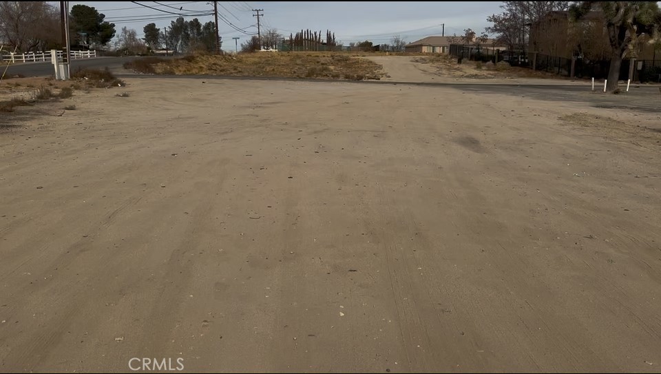 It is located in an opportunity zone. Rapidly developing area! The property is situated at the intersection of Condor and Mojave, near existing retail development and residential development. The lot is 15,300 ft. Corner flat lot with access from Mojave Drive and Condor Avenue. The property is zoned C2, allowing for various commercial uses, including retail and shopping centers, offices, AV Chargers. The property has easy access to the 15 freeway. The surrounding area is home to a mix of commercial and residential properties, including new developments.