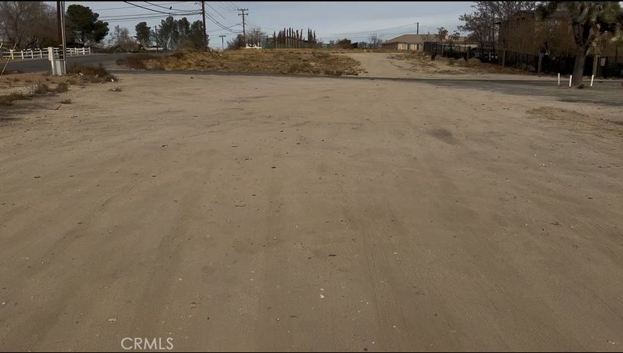 It is located in an opportunity zone. Rapidly developing area! The property is situated at the intersection of Condor and Mojave, near existing retail development and residential development. The lot is 15,300 ft. Corner flat lot with access from Mojave Drive and Condor Avenue. The property is zoned C2, allowing for various commercial uses, including retail and shopping centers, offices, AV Chargers. The property has easy access to the 15 freeway. The surrounding area is home to a mix of commercial and residential properties, including new developments.