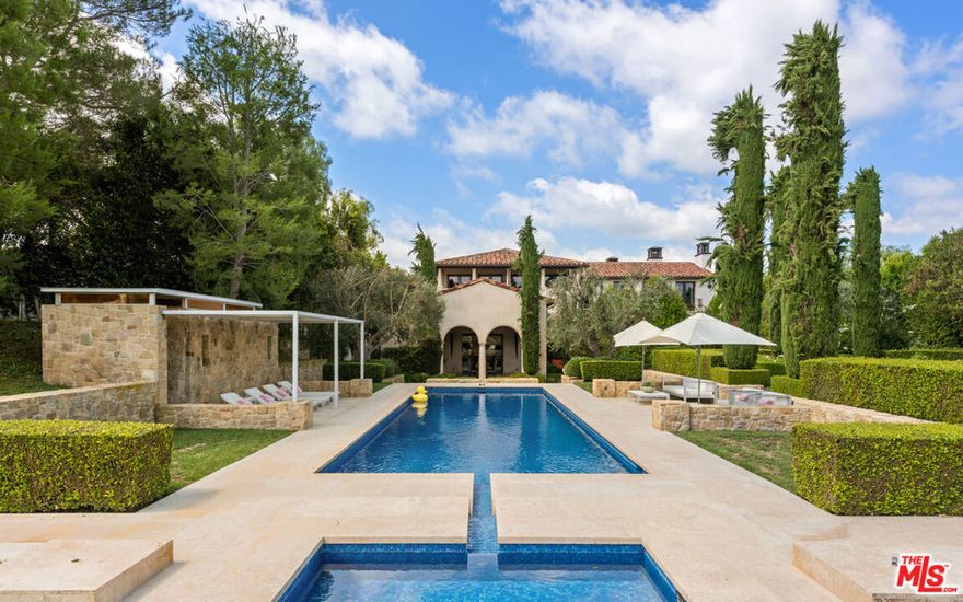 Situated in a esteemed Bel Air Crest 24-hour guard gated community sits this one-of-a-kind estate epitomizing luxury and sophistication. Offering an extraordinary living experience, this estate welcomes you with a grand entrance featuring a meticulously landscaped lot, lush expansive grounds and sweeping mountain views. An impressive architectural facade with timeless design seamlessly blends modern elements with classic charm throughout. Upon entrance, you are embraced with soaring ceilings, an abundance of natural light streaming through large windows and a spacious open floor plan. Offering 8 luxurious bedrooms and 13 bathrooms, including an exquisite primary suite that serves as its own private retreat. The primary bedroom features a spacious layout, sitting area and tranquil HIS and HER dual bathrooms complete with a soaking tub, walk-in shower and showroom style walk-in closets. Additional amenities in this home include an elevator that services the 3-levels, multiple courtyards, two offices, library, fitness center, wine cellar, and garage that can accommodate up to 16 cars. The large backyard showcases a pristine pool, spa, covered BBQ, and a spacious patio area perfect for outdoor dining and relaxation. Not to be overlooked, the Bel Air Crest community includes a new clubhouse with a huge brand new gym, putting greens, multiple tennis and basketball courts and children's playgrounds.