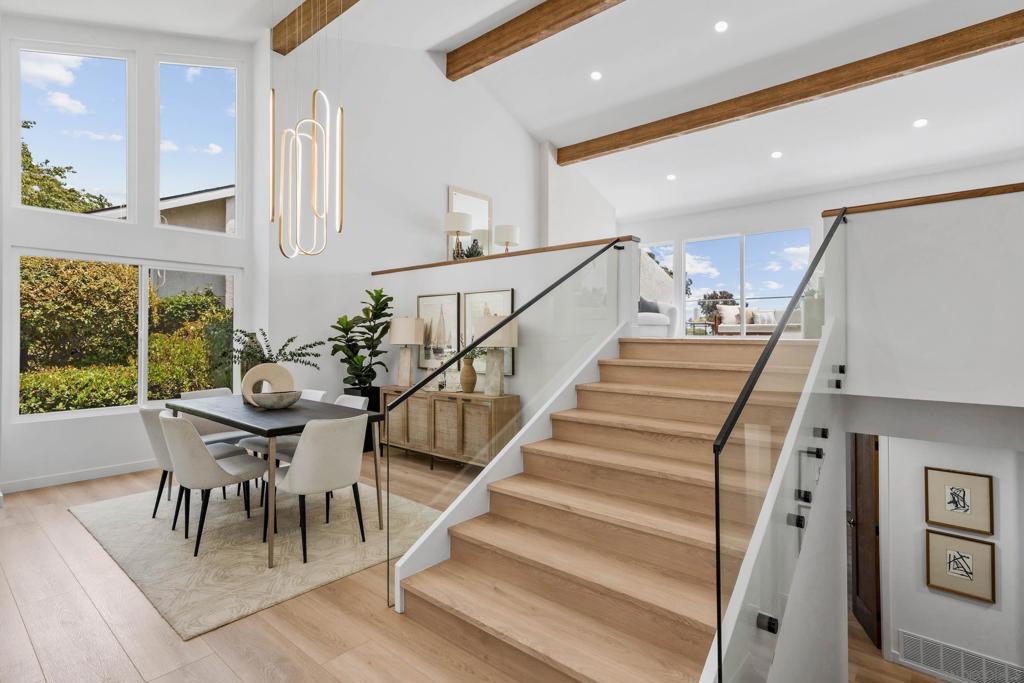 Nestled in a cul-de-sac in the hills of Mount Soledad, this elegant 3-bedroom, 3-bathroom home offers breathtaking VIEWS, vaulted ceilings and abundant natural light all throughout the home. Everything in this home has been completely remodeled including the gourmet kitchen with custom Italian porcelain countertops and top-of-the-line Thor appliances. The primary suite features a handcrafted marble vanity, a custom walk-in closet, and a secluded patio, creating a peaceful personal retreat. Throughout the home, high-end finishes abound—including Taj Mahal Quartzite countertops and a custom bar. The sought-after Mount La Jolla community premium amenities include: 4 pools, tennis courts, spa, fitness center, library, clubhouse, high-speed internet, premium cable, water, and fire and earthquake insurance. With exceptional finishes and sophisticated design, this home truly embodies the best of La Jolla living.