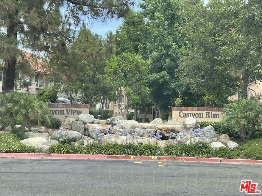 Stunning 2 Bed, 2 Bath Condo with Canyon Views & Unique Outdoor Space! Welcome to your new home! This beautifully maintained 2-bedroom, 2-full bathroom condo offers the perfect blend of comfort, style, and rare outdoor space. Featuring laminate and tile flooring throughout, this home boasts a warm, modern aesthetic with low-maintenance living. Enjoy the convenience of two single-car garages, one attached directly to the unit and a second detached for added flexibility and storage. Step outside to your private, oversized front yard area, a rare find in this community ideal for relaxing, gardening, or entertaining guests. From your front windows and yard, take in the serene canyon tree views that offer a peaceful, nature-filled backdrop rarely found in condo living. Don't miss your chance to own one of the few units in the neighborhood with this combination of natural beauty, spacious outdoor living, and dual garages. This is more than a condo, it's a lifestyle.