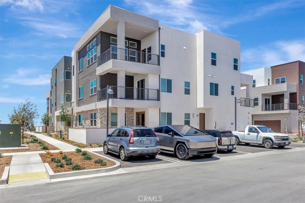 BRAND NEW - NEVER LIVED IN - TOP FLOOR CONDO - 3rd floor walk-up - Private one bedroom, one bath condo with private balcony & separate storage room across hall - CLEAN, FRESH, NEW!! With one-car garage on 1st floor! ALMOST 1000 square feet of living space - just LOVELY! Bring your own washer and dryer - Refrigerator included. Beautiful finishes in the Amaris neighborhood of the Great Park - minutes from shopping Spectrum, water park, all sorts of Great Park amenities including pool, clubhouse, trails - in a neighborhood of the newest stacked flats. Some details not available through county as yet-best to follow GPS.