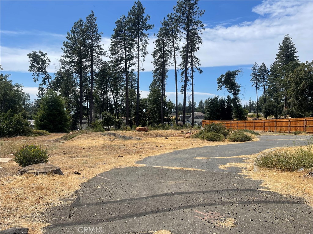 Nestled on popular Cherry Lane in the heart of Paradise! This prime location is ready for you to build your NEW home on this nearly level lot. Property is partially fenced and offers views of trees, neighborhood and sunset skies. Previous home was 3 bedrooms, 2 baths and over 1500 square feet. Take a look today and become a part of Paradise, a community full of growth and potential including new schools and multiple outdoor adventures.