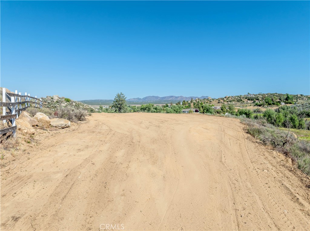 Get a head start on development with not 1, but 2 water wells on this private, usable parcel inside Lake Riverside Estates. Head down the driveway to this secluded and build-able flag lot and step out onto the large cleared and flat potential home site and look down over the greenery and beauty that this over-sized 3.23 acre lot provides. Take advantage of the seasonal creek passing by the property line, large mature cottonwood trees, and did I mention the 2 water wells? Only 30 minutes from the restaurants, shopping centers, and wineries of Temecula, or a quick 45 minute drive down to the golf courses and resorts of Palm Desert. Don't forget to enjoy all the amenities Lake Riverside has to offer including a 55-acre fishing lake, 3,600' lighted airstrip, maintained roads, playgrounds, cabanas, sports courts, pool, security patrol, and gated entry. Come drive out today and start planning your future dream home on this magnificent piece of land.