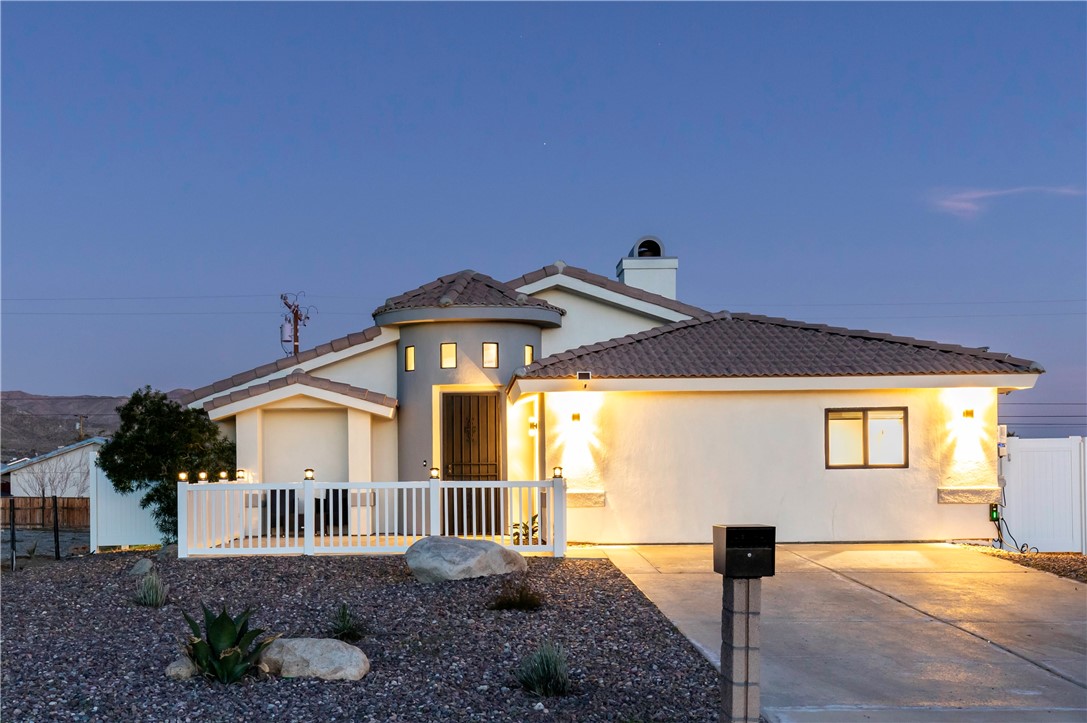 Experience the pinnacle of desert luxury living in this stunning Desert Hot Springs pool home, showcasing breathtaking mountain views and resort-style amenities. This contemporary, turnkey residence offers 4 bedrooms, 3 bathrooms, including a spacious master suite with walk-in closet and en-suite double vanity bathroom. The 4th bedroom functions as an optional permitted ADU (garage conversion) complete with its own bathroom and kitchenette, ideal for guests, extended family, or as a private rental opportunity. With nearly 2,000 sq. ft. of modern living, the home is designed for both comfort and entertainment. The open floor plan features tiled floors, recessed lighting, soaring ceilings, and a stylish fireplace in the living room. A fully equipped kitchen provides abundant counter space, storage, and pantry—perfect for culinary enthusiasts. Step outside to your private desert oasis: a beautifully designed backyard with a patio-level lounging area and a fully gated new saltwater pool and spa for added security. The pool is enhanced with brand new customizable color-changing lights and can be conveniently operated remotely while you’re away. Enjoy peace of mind and savings with solar panels that significantly reduce electricity costs. Additional amenities include an EV charger and a long driveway that accommodates up to 4 cars. Perfectly located near Palm Springs, casinos, dining, shopping, and entertainment, this exceptional property is ideal for personal enjoyment or as a smart investment opportunity. Don’t miss your chance to own this exquisite home and embrace the very best of Desert Hot Springs living.