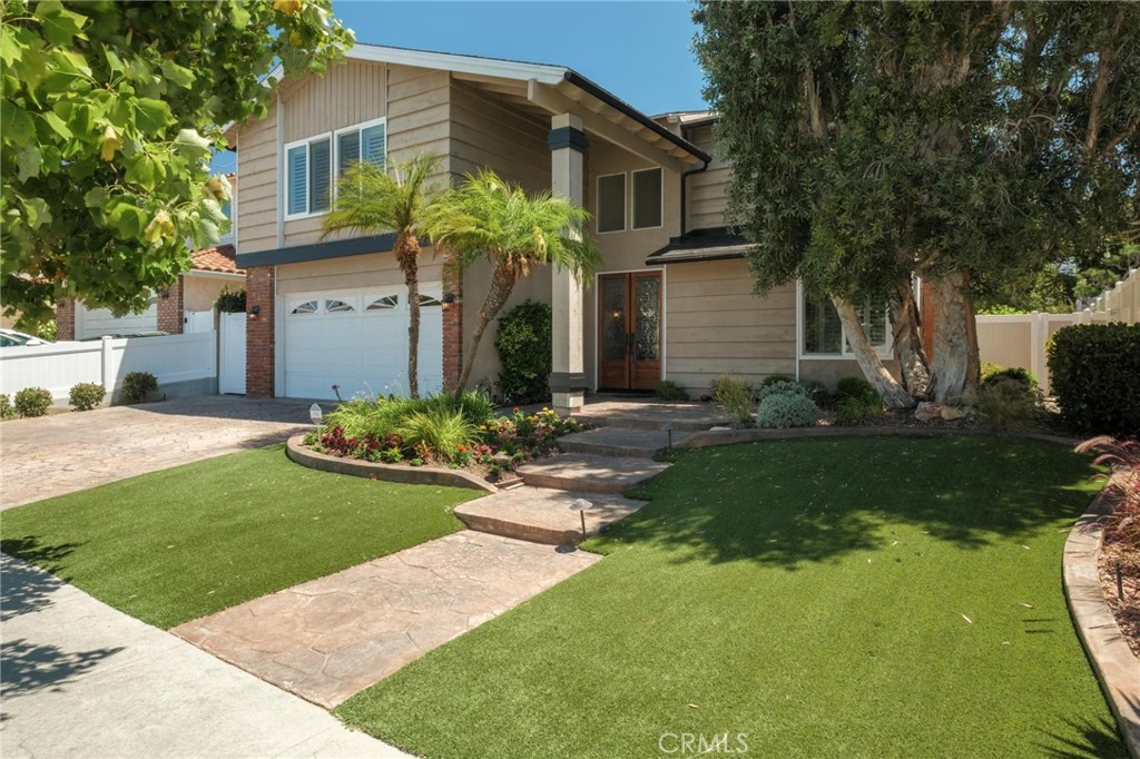 Located on a quiet street in the highly sought-after Southeast Torrance neighborhood, this beautifully maintained two-story home built in 1976 offers 5 bedrooms and 3 bathrooms across 2,626 sq ft of bright, thoughtfully designed living space.
Step inside to a warm, inviting layout that blends formal and casual living. The living room welcomes you with a cozy fireplace and opens to the dining area—perfect for gatherings. The kitchen features abundant cabinetry and stainless steel appliances and flows seamlessly into the family room, which overlooks the private backyard. A powder room and direct access to the attached 2-car garage add everyday convenience.
Upstairs, the spacious primary suite includes an ensuite bath, while 4 additional bedrooms and a remodeled full bathroom offer versatile options for a home office, media room, or guest space.
Step outside to a tranquil backyard retreat featuring a patio area perfect for outdoor dining, weekend barbecues, or gardening. Additional highlights include plantation shutters, crown moulding, dual-pane windows, newer central heating and air conditioning, newer electrical panel, laminate floors and recessed lighting.
Ideally situated in the award-winning Torrance Unified School District, this home is near local schools, Sur La Brea Park, shopping, and dining, bringing convenience and community to your doorstep.
Don’t miss the opportunity to own this spacious and well-cared-for home in one of Torrance’s most desirable neighborhoods.