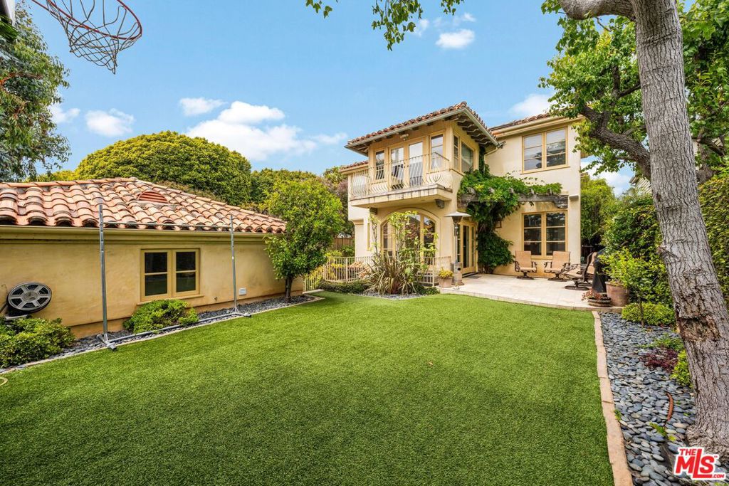 Discover the Pinnacle of Luxury Living at 610 Euclid Street! A family residence that perfectly blends timeless sophistication with modern comfort. Situated in the highly desirable North of Montana area of Santa Monica, at the coveted cross streets of Euclid and Alta, this home promises an unparalleled living experience. Built in 2001 with a vision ahead of its time, it offers an impressive 4,781 square feet of luxurious living space, far exceeding today's building limitations, all on a generous 7,500 square foot lot. As you approach, the beautifully landscaped front yard provides a touch of privacy and a serene welcome. Step through the grand double-wide doors into an elegant formal living area, where floor-to-ceiling French doors open to a charming patio, setting the stage for seamless indoor and outdoor living. The main floor features a dedicated office or cozy den and a convenient powder room. Just before entering the kitchen, you'll find a spacious dining area that connects to a garden atrium, showcasing lush greenery and inviting natural light. The heart of this home is the expansive kitchen, equipped with high-end appliances, a walk-in pantry, and a sunlit breakfast area that opens to yet another patio and a large, grassy yard - perfect for family gatherings and children's play. Ascending the grand staircase, you are greeted by a massive window and skylight, flooding the hallways with natural light. Large windows and floor-to-ceiling French doors offer views of the verdant atrium below. The first bedroom features its own balcony, overlooking the lush greenery in the front yard. The Jack and Jill bathroom is a picturesque retreat with a large lemon tree arching over the tub. The second bedroom includes beautiful built-ins and generous closet space, while the third bedroom boasts its own en-suite bathroom with a spacious stand-up shower. The primary suite is a sanctuary, featuring vaulted ceilings with exposed wood beams, a sitting area or office space, and a private balcony overlooking the backyard. The expansive primary bathroom is a spa-like retreat with a steam shower, rain showerhead, jacuzzi with double-sided windows for abundant natural light, and a vast walk-in closet. The versatile lower level of the home includes three large rooms: a secondary family room, a potential gym area, and a full bedroom with an en-suite bathroom. This hybrid space also includes a dedicated laundry area, making it perfect for various uses, whether as a family recreation area, a home gym, or additional living quarters.Outside, the detached garage provides convenient parking and storage. The beautifully landscaped yard offers multiple outdoor living spaces, ideal for entertaining and enjoying the Southern California lifestyle.Built to exceed the standards of its time, this home offers the ultimate in coastal living with its proximity to the beach, top-rated schools, upscale shopping, and fine dining. Don't miss the opportunity to make 610 Euclid Street your new home. Contact us today for a private tour and discover the unparalleled lifestyle that awaits you.