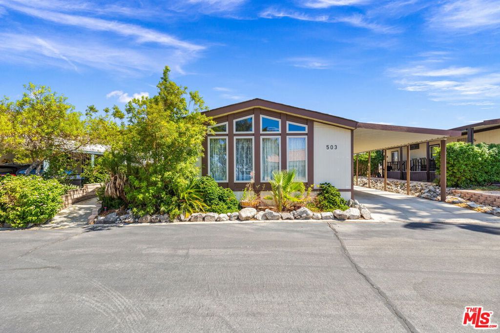 Resort Living Just Steps from the Pool. Welcome to the beloved SKY VALLEY RESORT, where COMFORT meets CONVENIENCE in the most delightful way. This beautifully REMODELED MANUFACTURED HOME feels like a PRIVATE RETREAT with QUARTZ COUNTERTOPS, NEW APPLIANCES, FRESH PAINT, UPDATED WINDOWS, and STYLISH FURNISHINGS INCLUDED. What truly sets this home apart is its LOCATION. You are literally STEPS from the MAIN POOL and CLUBHOUSE so close it feels like the MINERAL-RICH SWIMMING POOLS are in your own backyard. MORNING DIPS, SUNSET SOAKS, and SPONTANEOUS SPA DAYS are just a few steps away. LOW MONTHLY SPACE RENT of $1203. Perfect as a FULL-TIME RESIDENCE, WEEKEND ESCAPE, or WINTER HAVEN. Minutes from PALM SPRINGS, EL PASEO SHOPPING, and LA QUINTA ART FESTIVALS. Close to INDIAN WELLS TENNIS, PGA GOLF, and ACRISURE ARENA. Easy access to COACHELLA, STAGECOACH, and JOSHUA TREE HIKING. Resort amenities include HEALING GEO-THERMAL MINERAL POOLS AND SPAS, PICKLEBALL, TENNIS, HIKING TRAILS, GYM, and MORE. Vibrant FAMILY-FRIENDLY COMMUNITY with YEAR-ROUND ACTIVITIES. Whether you are seeking SERENITY, SUNSHINE, or a splash of ADVENTURE, this home offers it all with the POOL practically in your BACKYARD and the DESERT'S BEST just down the road.