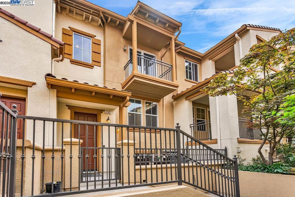 Welcome to this stunning modern contemporary North facing townhouse style condo in Fremont’s highly sought-after Montebello Community of Warm Springs. Built by KB Homes, this beautifully designed residence features 9 ft tall ceilings, abundant natural light, and an open layout with separate living, dining, and family rooms. The chef’s kitchen offers oak-style cabinetry, granite countertops with tile backsplash, stainless steel appliances, and a center island with bar seating. The spacious primary suite boasts sloped high ceilings, a private balcony for relaxation, a spa-inspired bathroom with dual vanities, a split layout for privacy, and a walk-in closet. A versatile downstairs room can serve as a bedroom, office, or playroom. Additional highlights include laminate flooring in the main living areas, new upgraded carpet upstairs, recessed lighting, Bose surround sound speakers, multi-zone heating and A/C, in-unit laundry, and a two-car attached garage. Community amenities include a playground and clubhouse—perfect for gatherings and play. Conveniently located near top-rated schools, shopping, dining, and major commute routes, this home offers the perfect blend of comfort, style, and convenience. A must-see! Open house Sat 9/20 & Sun 9/21 from 1:00-4:30 pm.