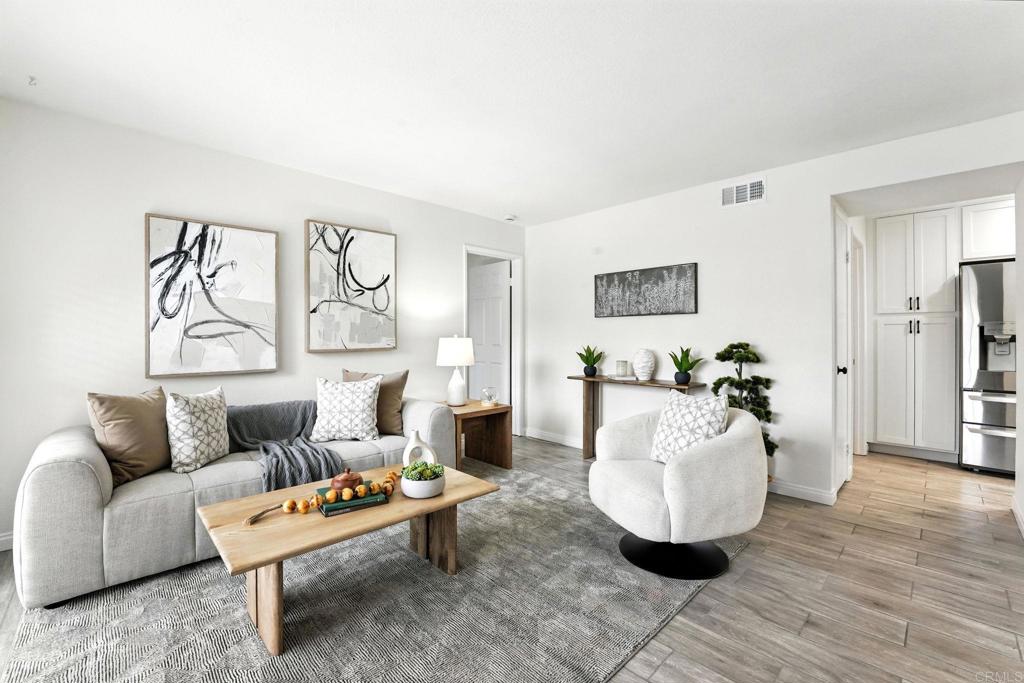 Welcome to Marisol, a desirable community in Rancho San Diego! This spacious 2 bed, 2 bath condo offers 1,136 sq. ft. of comfort and stylish upgrades. The remodeled kitchen showcases new cabinets, porcelain tile flooring, and stainless steel appliances, creating a fresh and updated look. The bright living and dining area with shutters opens to a private patio, perfect for relaxing or entertaining. Bedrooms have brand-new carpet, and bathrooms feature sleek upgrades. Enjoy central heating and air, a dedicated laundry room with hookups, and two carport spaces with extra storage plus guest parking. Freshly painted and move-in ready, Marisol also offers two pools, spas, and a BBQ area. Conveniently located near shopping, schools, and freeway access—city close with a serene country feel!