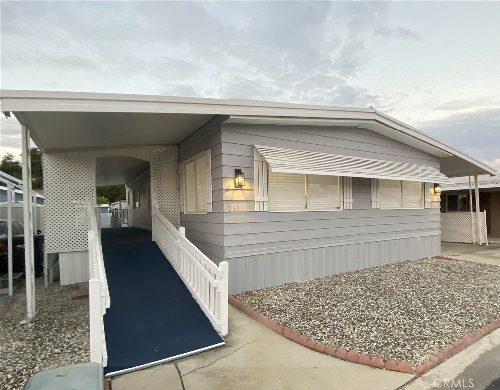 Beautifully Updated Home in Resort-Style 55+ Community!
Welcome to this charming and cozy 2-bedroom, 2-bath manufactured home located in the highly desirable Colonial Country Club golf community of Hemet, CA. Recently updated with a modern look, this home features fresh interior and exterior paint, new luxury vinyl plank flooring, refinished cabinets and countertops, recessed lighting, and new stainless steel kitchen appliances. The kitchen includes a center island with pendant lighting, perfect for entertaining or casual dining.
Enjoy year-round comfort with central heating and air conditioning. The exterior offers a covered front porch with ramp access, a covered carport, and a storage shed for convenience.
This pet-friendly community offers resort-style amenities, including an 18-hole executive golf course, 6 new pickleball courts, swimming pool and spa, indoor shuffleboard courts, billiards room, ballroom, on-site hair salon, fitness center, bridge and card rooms, and horseshoe pits.
Conveniently located near shops, restaurants, parks, cafés, and the local farmers market, with easy access to Los Angeles, Orange, and San Diego counties, Palm Springs, nearby wineries, and local casinos. Enjoy scenic mountain views and the active lifestyle this vibrant community has to offer!
