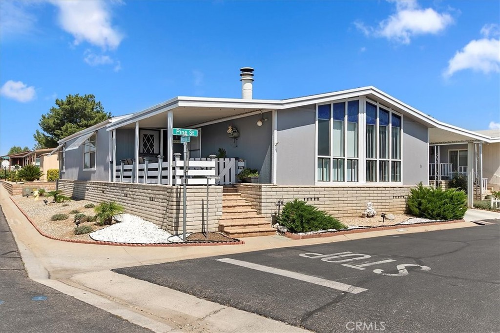 The GEM of this park is ready for a new owner. Completely remodeled. Centrally located & a Corner Lot. There is not a thing you need to do to make this home your own. 2 Bedrooms & 2 Bathrooms. This open floor plan for an entertainers delight. Built in bar. Cozy fireplace. Oversized laundry room. This home will hit all of your checklist.