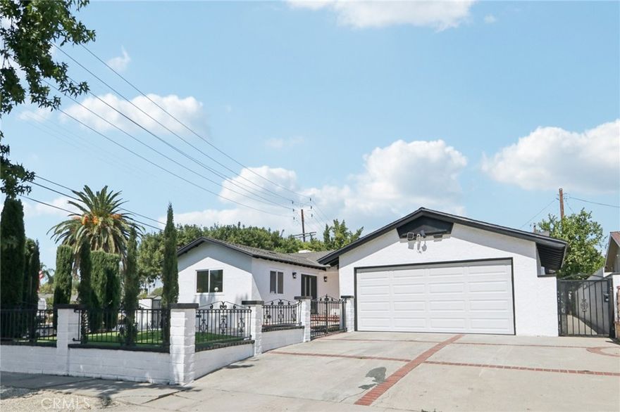Welcome to this beautifully renovated Granada Hills gem situated on a spacious corner lot. This single-story home boasts a modern open-concept layout with brand-new interior and exterior paint, a new roof, and upgraded laminate flooring throughout. The stunning chef’s kitchen is the centerpiece of the home, featuring a 9-foot waterfall island with granite countertops, added cabinetry and pantry space, and sleek recessed lighting that flows seamlessly into the living and dining areas.



Offering two primary suites and three fully remodeled bathrooms, this home is designed for comfort and flexibility. Every detail has been thoughtfully updated, including a 200-amp electrical panel, new garage door, fully drywalled garage with epoxy flooring, and recessed lighting. With its huge lot, curb appeal, and high-end finishes, this move-in-ready property is the perfect blend of modern design and everyday functionality.