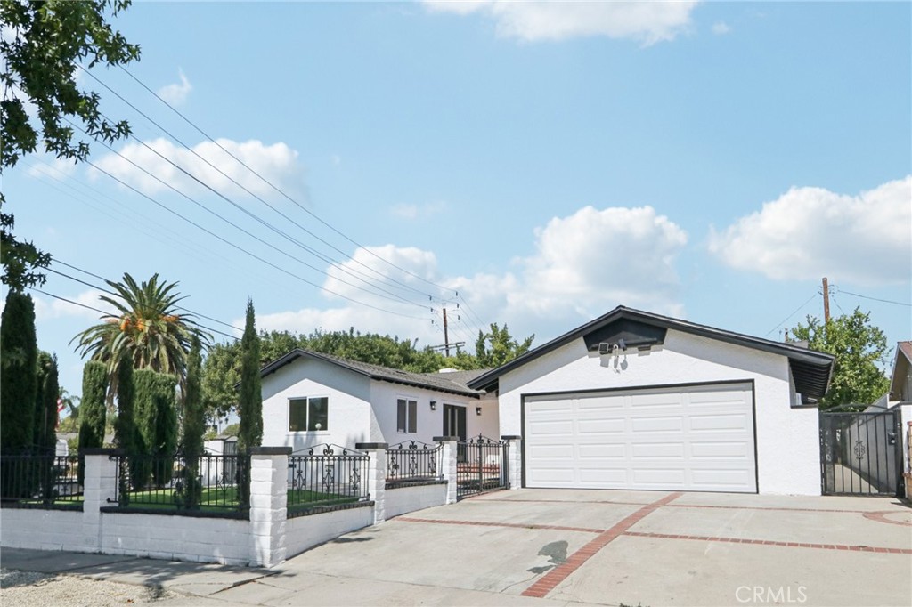Welcome to this beautifully renovated Granada Hills gem situated on a spacious corner lot. This single-story home boasts a modern open-concept layout with brand-new interior and exterior paint, a new roof, and upgraded laminate flooring throughout. The stunning chef’s kitchen is the centerpiece of the home, featuring a 9-foot waterfall island with granite countertops, added cabinetry and pantry space, and sleek recessed lighting that flows seamlessly into the living and dining areas.
Offering two primary suites and three fully remodeled bathrooms, this home is designed for comfort and flexibility. Every detail has been thoughtfully updated, including a 200-amp electrical panel, new garage door, fully drywalled garage with epoxy flooring, and recessed lighting. With its huge lot, curb appeal, and high-end finishes, this move-in-ready property is the perfect blend of modern design and everyday functionality.