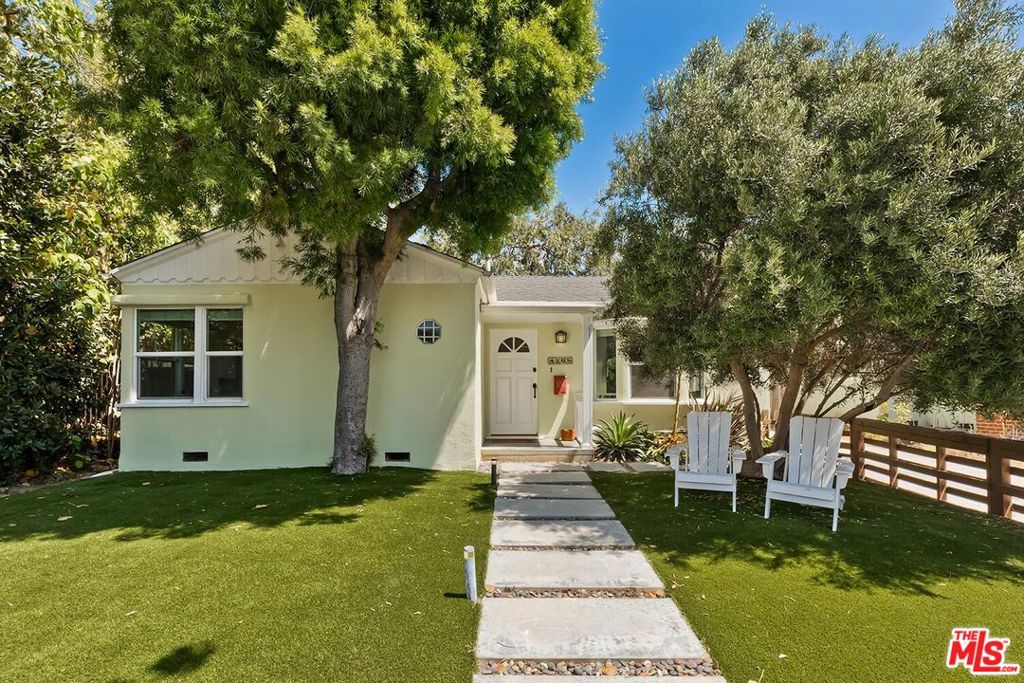Elegant Remodeled Mid-Century in Culver City's Coveted Carlson Park. Nestled south of Braddock in one of Culver City's most sought-after neighborhoods, this beautifully reimagined Mid-Century residence perfectly balances timeless character with modern sophistication. Step into the light-filled living room, where newly refinished hardwood floors, fresh designer paint, and an expansive picture window frame views of the gated front garden and tree-lined street. The updated kitchen features crisp white cabinetry and a professional-grade Viking refrigerator, flowing seamlessly into the dining area. French doors extend the space outdoors to a private patio, creating an effortless indoor-outdoor living experience. The generous primary suite also opens through French doors to the backyard, offering a serene retreat. Designed for both relaxation and entertaining, the lush outdoor sanctuary showcases a built-in barbecue, al fresco dining space, and a spacious turf lawn surrounded by mature trees and privacy hedges. A detached garage, thoughtfully finished with polished concrete floors and French doors, provides endless possibilities as a home office, gym, or creative studio. Located within the boundaries of Culver City's award-winning schools and moments from the vibrant heart of downtown with its renowned restaurants, boutiques, weekly Farmers Market, and nearby major studios including Apple, Amazon, HBO, and Sony this home is a rare offering in an exceptional neighborhood.