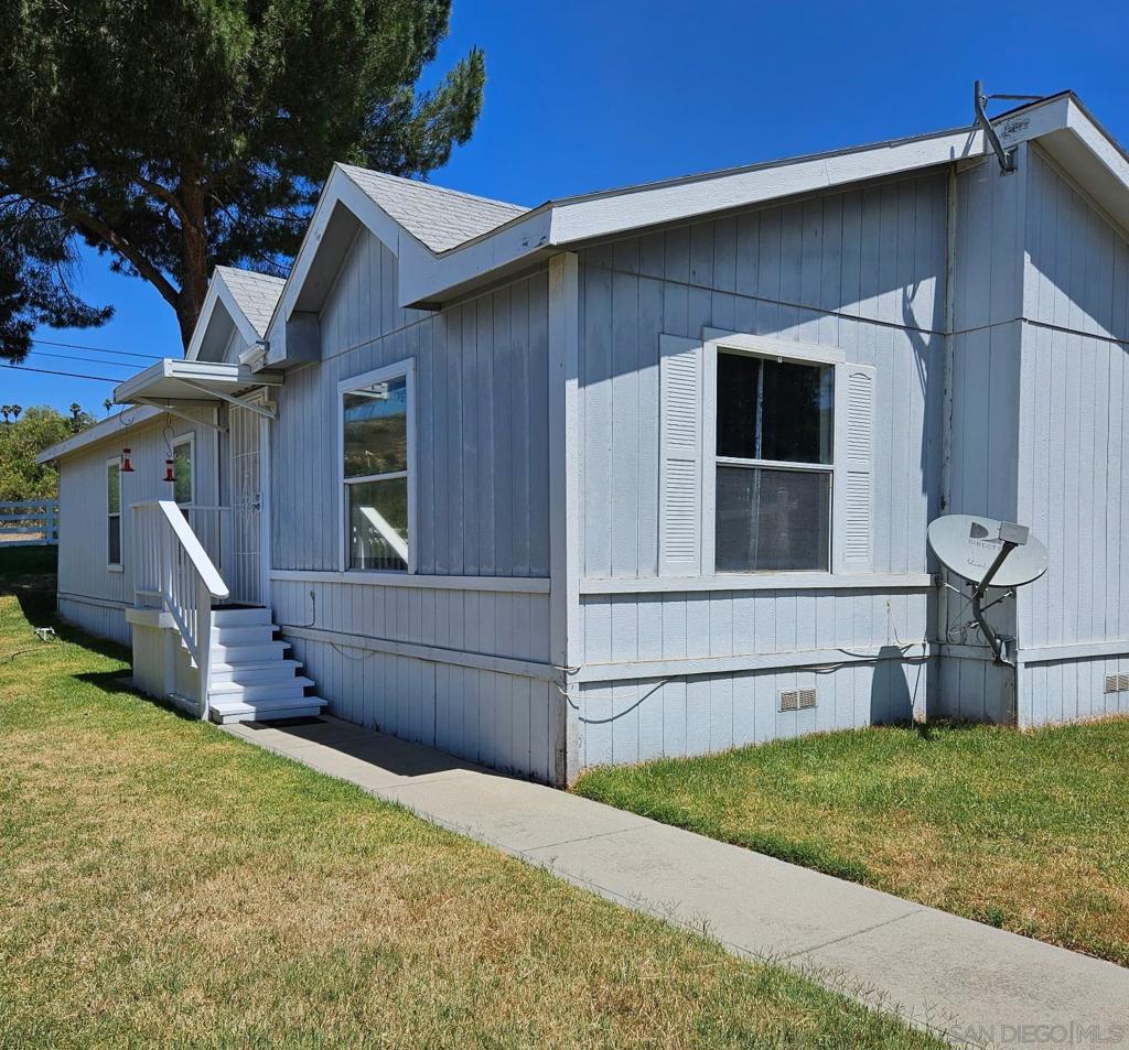 Best Value in Ramona! Senior living at its finest. Rare opportunity to own a 3BR end unit in a small park. Space rent is currently $1040/Mo. Lowest space rent in town. Enjoy the peace and serenity of rural Ramona with mountain views, majestic oak and pine trees. This is not your typical mobile/ manufactured home park. Open floor plan, large, sunny kitchen with pantry, gas stove and lots of storage. Very spacious primary suite and large bathroom. Laundry room with Washer/Dryer included. Close to town. Carport with parking for 2 cars. Must be 55+ to live here. Pet restrictions. Park has a small vineyard. No additional amenities. Live the country lifestyle rather than traditional parks in town! You'll love the location!