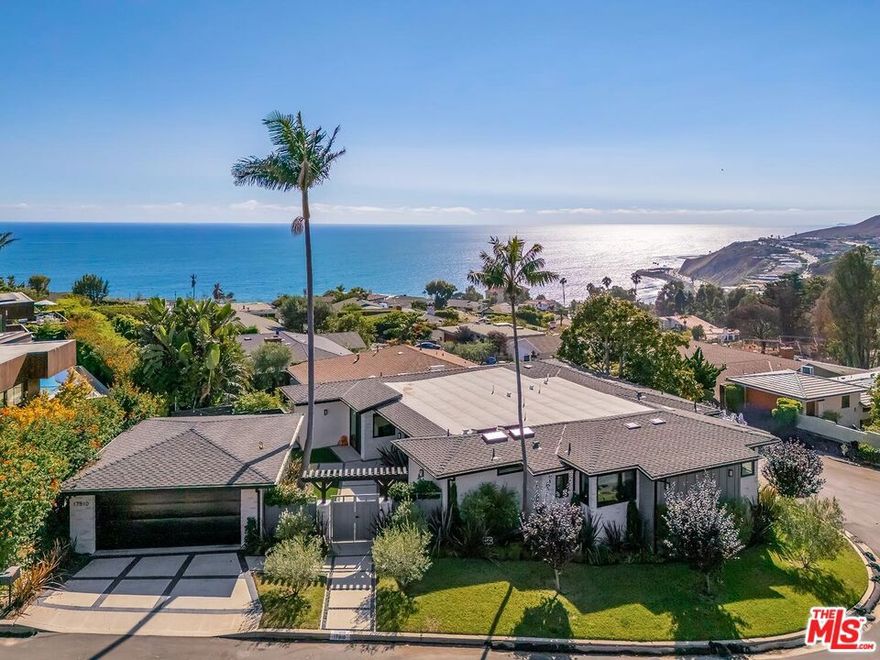 Fully remediated and move-in ready, this sleek single-level contemporary home was completely renovated and expanded in 2023 to the highest design standards. Set in the desirable Castellammare Mesa neighborhood, it welcomes you through a private gated entry and onto a tranquil wood deck, perfect for morning coffee or sunset cocktails. Inside, dramatic ocean views frame the open-concept chef's kitchen, dining, and living areasincluding a bar with dual wine fridges creating an effortless flow for everyday living and entertaining. A serene primary suite features a spa-inspired bath and custom-designed closet, while two additional bedrooms share a dual-sink bath. A fourth bedroom offers flexibility for guests or a home office, and a separate laundry room with sink adds convenience. Custom finishes, including top of the line stainless steel appliances, quartz counters, designer window treatments along with other thoughtful details elevate every space. The property not only showcases contemporary style but also meets current fire-safety and code compliance standards. With easy access to nearby Palisades conveniences including Vons on PCH and Starbucks on Palisades Drive, you'll find both comfort and ease in this coastal retreat.