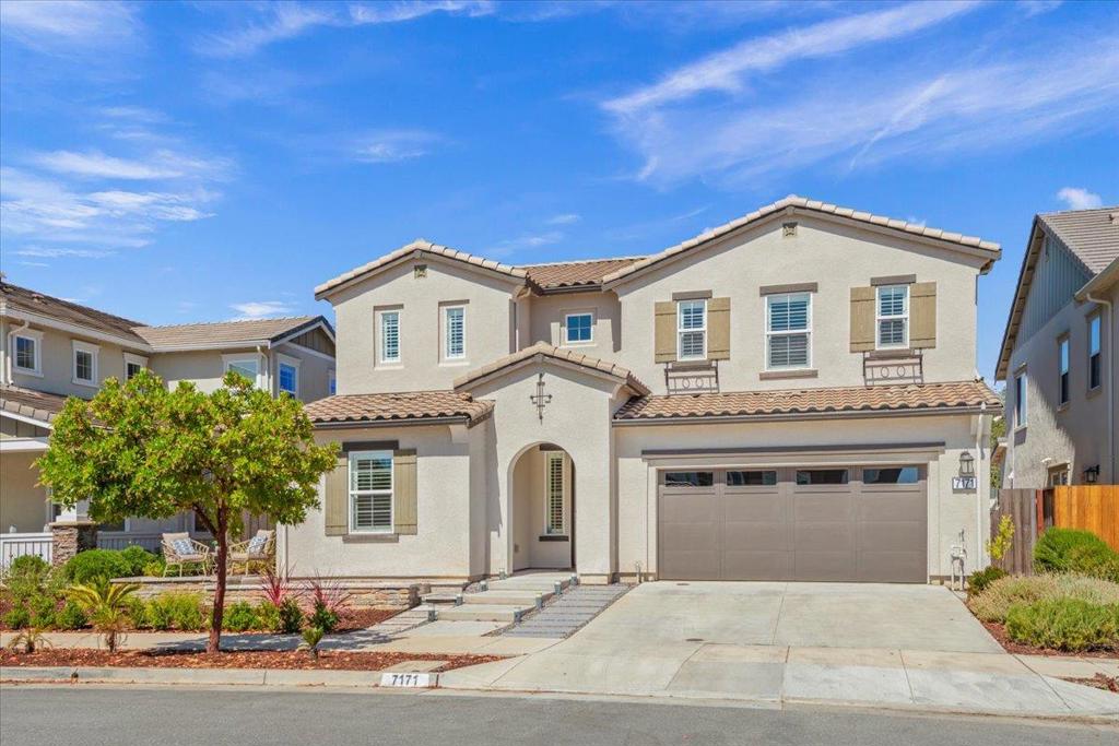 Welcome to your dream home, a stunning modern retreat that blends luxury, comfort, & breathtaking views! This home has a bright & airy open-concept living area on the first floor, featuring high ceilings & an abundance of extra-large windows that flood the space with natural light. The kitchen, complete with quartz countertops, shaker-style cabinets, gas range & a spacious pantry. Also on the first floor is a bedroom & full bathroom that provides flexibility for guests, an office, or multi-generational living. Upstairs, discover a serene primary en-suite retreat, with a generous walk-in closet & a large bathroom with dual vanities & soaking tub. This smart home has dual-zone HVAC, tankless water heater & solar power for both the home & pool. The PebbleTec pool has swim jets - great for relaxation, play or exercise. The private resort-style backyard also includes an outdoor fireplace & California room that create an ideal space for year-round enjoyment. Backing to a greenbelt with no rear neighbors, this home offers both privacy & stunning views of the western foothills. The 2-car garage is extra spacious with a designated area for ample storage. This exceptional property combines sophisticated design, energy efficiency & a prime location, making it the perfect place to call home.