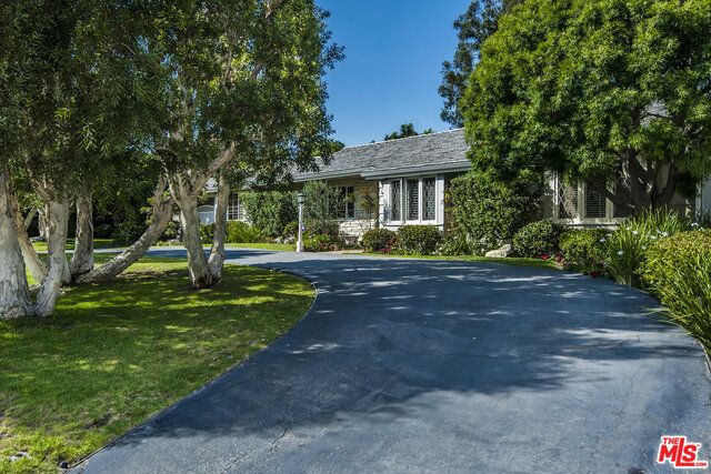 MASSIVE REDUCTION! First time ever on the market! Apx. 38,000 sqft FLAT property of a scale rarely seen in Santa Monica, located on a most coveted street! The charming 4 bedroom, 3 bath Mid-Century Ranch home is bright, cheerful and in good condition. This inviting abode opens out onto a huge, sprawling, sunny, park-like yard featuring many beautiful specimen and fruit trees. The property also offers views of the Santa Monica Mountains. This is a Trust Sale with no requirement of court confirmation. A flat lot of this size presents limitless possibilities. Buyer to conduct their own investigations and due diligence; Seller and Listing Broker make no guarantees. NOTE: Seller requests that no photos or video be taken of the home's interior. There is no sign on the property. Click on "Virtual Tour" link to view an unbranded aerial video tour of this vast property.