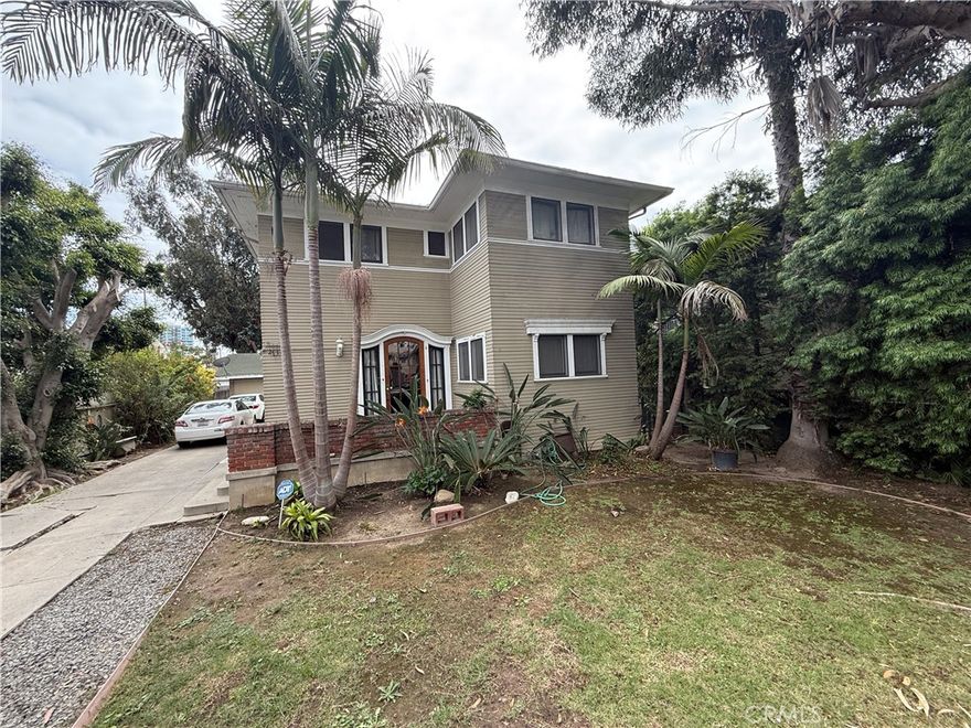 Fabulous location on a tree lined, closed-end street in Bluff Heights. 2730 E Mariquita St, is a spacious 5 bedroom home, set on a sprawling 7,554 square foot lot and ideal for larger households or anyone seeking extra flexible living space. A long driveway leads to a three-car garage, ensuring ample parking and convenient access for multiple vehicles. The garage also offers excellent potential for adding an ADU, making the property suitable for those interested in income opportunities or multigenerational living. The home, built in 1923 with over 2,000 square feet of living space, fits beautifully within a sought-after Long Beach neighborhood and features mature gardens and a secluded front yard. In addition, it is walking distance to the beach, Bluff Park, exciting 4th St Retro Row and Broadway corridor restaurants and shops, Long Beach Museum of Art, and a short distance to downtown or Belmont Shore.