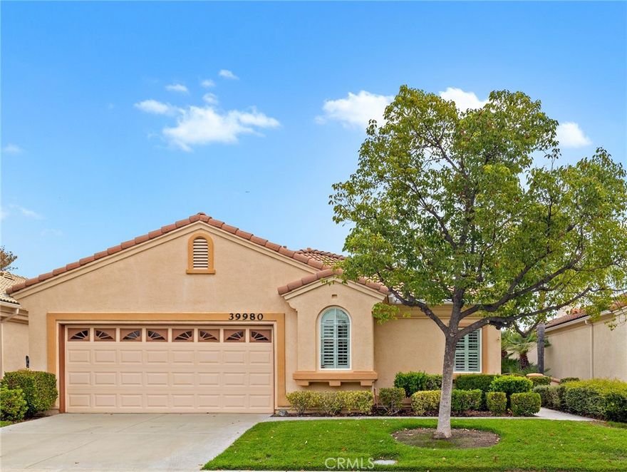 BEAUTIFUL SINGLE STORY 2,100 square foot home in The Colony, one of SoCal's most desirable GATED SENIOR COMMUNITIES.  A brick-accented walkway welcomes you to the double entry doors with security screens. Featuring plantation shutters throughout, upgraded tile & wood type flooring, wide baseboards & soaring ceilings. The large kitchen boasts white cabinets, stainless appliances, granite countertops and so much storage space with convenient pull-out shelves in many cabinets. The spacious great room is perfect for family gatherings with a fireplace & media niche. Walk out onto your solid aluminum patio cover with views to a WIDE NATURAL GREENBELT, AFTERNOON SHADE & easy-care landscaping. The spacious primary suite has plenty of room for your bed, a sitting area & offers a walk-in closet with built-in storage. The sumptuous bath is finished in spectacular marble with dual sinks, large soaking tub & a shower with a luxury rimless door. One of the bedrooms has built-in desks/storage cabinets and a walk-in closet with shelving. The 3rd bedroom is oversized and has a guest bath nearby. Indoor laundry with a sink, lots of storage cabinets, pull-out shelves and washer/dryer are included. The garage has lots of built-in cabinets, a workbench area, room for a golf cart + 2 cars & a newish garage door opener.  You will love the ENERGY SAVING FEATURES of Low-E windows, attic fan, attic heat shield & extra attic insulation.  Water heater installed in 2022 with a circulating pump.  Whole house water filtration system replaced in 6/2023.   The Colony is a PREMIER GATED SENIOR COMMUNITY for ages 55+ with a RESORT CLASS CLUBHOUSE, year-round pool, 2 spas, lighted pickle ball/paddle tennis and tennis courts. You can enjoy the gym, library, ping pong, billiards, hair/nail salon. There are groups & activities for all interests with an auditorium for shows, dances, banquets, concerts, movies, bingo & parties for all occasions. A privately owned 18-hole golf course is inside the gate. The HOA waters & maintains all front landscaping. Guard gated entry and 24-hour security patrol give you peace of mind. Close to stores, restaurants, medical, casinos and wineries. You will love this turn-key home, ready for you today. Welcome to the Colony with friendly neighbors and sense of community as you enjoy TRUE RESORT STYLE SENIOR LIVING.