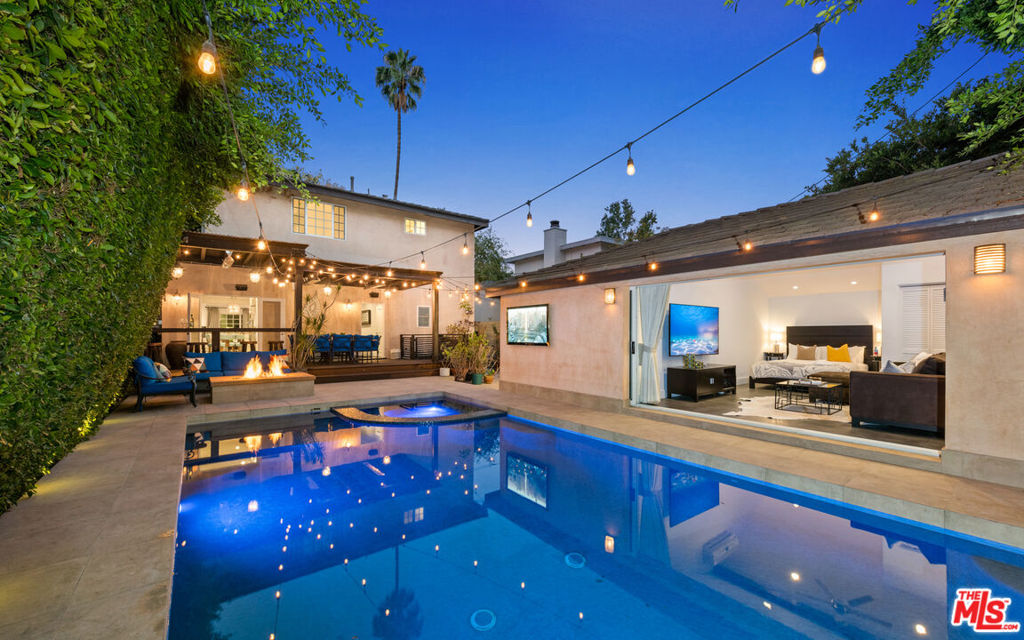 Move-in date March 21st. It is fully furnished and turnkey, making it ideal for short-, mid-, or long-term leases. Treat yourself to the refreshing charm of this gated urban oasis, ideally situated in the heart of West Hollywood. Impeccably decorated with pure white walls and dark wood floors and accents, you'll appreciate tasteful splashes of color throughout. The main floor living spaces include a gourmet kitchen, a formal dining room, and a grand living room with a fireplace and bar. A comfortable covered patio leads to a private sun deck featuring a glistening pool, spa, and a seating area with a fire pit. The spacious primary suite is designed for your comfort, boasting a fireplace, a walk-in closet, a jacuzzi bath, and a glass shower. Four additional guest rooms are available to accommodate your friends and family. This stunning Spanish contemporary home also includes a guest house, a gym, all-new smart TVs, and advanced security and camera systems. Located within walking distance of the Pacific Design Center, restaurants, boutiques, shops, and nightlife, this home puts the world at your fingertips.