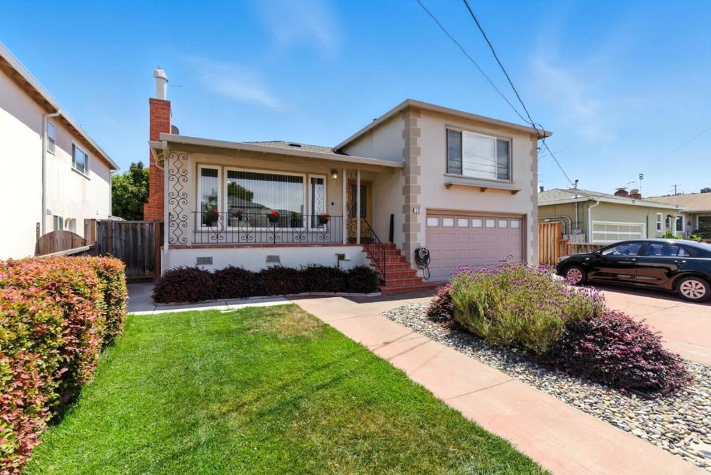 Welcome to 211 Anita Drive, a beautifully maintained Millbrae residence offering approximately 1,860 square feet of refined living space on a 5,050 square foot lot. Built in 1951, this timeless home blends classic charm with exceptional versatility. The inviting front porch sets the stage for a sun-filled living room, where a large picture window frames the serene neighborhood setting. An attached two-car garage provides convenience, while a private bedroom, bathroom, and kitchenette complete with a separate entrance offers the perfect retreat for guests, extended family, or a private home office. Ideally located just moments from Trader Joe's, Safeway, boutique shops, and celebrated dining, with BART, Caltrain, and Highway 101 only minutes away, this residence delivers both comfort and connectivity in one of Millbrae's most desirable neighborhoods.
