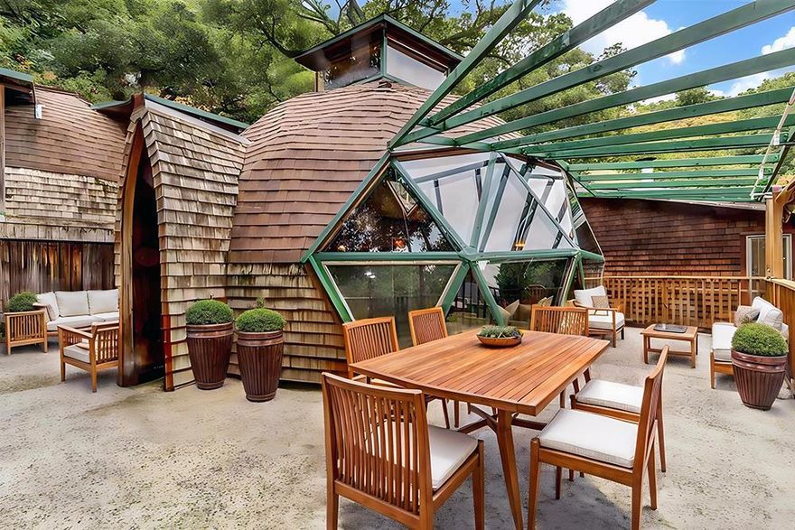 Tucked at the end of a quiet one-lane road, this remarkable geodesic dome home channels the vision of Buckminster Fuller in a stunning architectural statement. Nestled on a private one-acre hillside, it offers panoramic views of Diablo Valley and a true escape into nature.   An exceptional Lafayette schools were on the Sellers' minds when they were choosing the Toyon property for their family with two daughters.  The dome features recycled wood interiors, skylights, and expansive windows that fill the space with light. Unique touches, such as handmade stained glass, colorful cabinetry, and a custom shingled exterior, add charm and personality. Inside, a dramatic triangular window wall opens to a large deck, and the home features an updated kitchen, spacious bedrooms and baths, as well as both living and family rooms for relaxed, inspired living.   In January 2025, during the PG&E power shutoff, Lafayette residents faced days without power. But this home, powered by solar panels and a battery backup, stayed fully functional. "While neighbors relied on flashlights, our lights were on, the fridge running, and our lives uninterrupted."   All virtual staging is created for marketing purposes only. AS-IS Sale. Buyers shall satisfy themselves with a personal examination of the property.