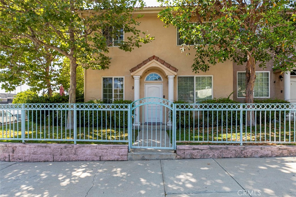Welcome to 9360 Sunland Park Drive Unit 3, a beautifully maintained end-unit townhouse nestled in a private, gated community in Sun Valley—built in 2006. Offering 1,550 sqft of upgraded living space, this home combines modern finishes, comfort, and convenience. Step into the bright, open-concept layout with high ceilings, recessed lighting, and crown molding that enhance the airy and elegant feel. The gourmet kitchen is equipped with granite countertops and ample cabinet space. Enjoy your morning coffee or evening night cap in the beautiful patio with access from the dining room and kitchen area or enjoy your evening by the beautiful stone accented fireplace in the living room. All 3 bedrooms are conveniently located upstairs with the primary suit featuring high ceilings and a private bathroom with tub. This unit also includes a large 2 car attached garage with EV charger included! Don't miss your chance to make this beautiful townhouse yours!