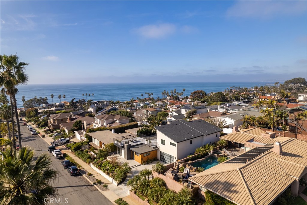 Experience the ultimate in coastal luxury with this stunning 4-bedroom, 4-bathroom modern home in Sunset Cliffs, just one block from the beach. Nestled on one of the most desirable streets in the community, this architectural masterpiece offers expansive ocean views, high-end finishes, and incredible outdoor living spaces.
Inside, an open and airy floor plan is bathed in natural light, featuring updated appliances, sleek modern finishes, and seamless indoor-outdoor flow. The gourmet kitchen is a chef’s dream, boasting state-of-the-art appliances, custom cabinetry, and a spacious island perfect for entertaining. The luxurious primary suite is a true retreat, complete with a spa-like ensuite, walk-in closet, and private balcony overlooking the Pacific.
Step outside to your expansive backyard oasis, ideal for entertaining with a spacious patio, lush landscaping, and room for al fresco dining under the stars. But the true highlight of this home is the nearly 1,000 sqft of upstairs deck space, offering unobstructed panoramic ocean views and front-row seats to San Diego’s breathtaking sunsets.
With its prime location just steps from the ocean, Sunset Cliffs Natural Park, and the best shopping and dining in Point Loma, this home captures the essence of luxurious coastal living.
Don’t miss this rare opportunity to own a modern beachside retreat in one of San Diego’s most coveted neighborhoods.