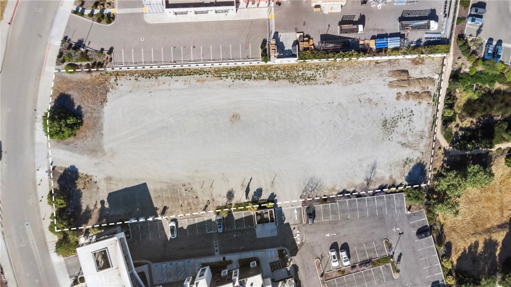 Commercial lot located within the City of San Luis Obispo’s Airport Area Specific Plan. An excellent opportunity for business development surrounded by businesses such as Harris Personal Injury Lawyers, House of Bread, Farmhouse Wine Lounge, PG&E, Monarch Home Services, and more. This relatively level parcel offers convenient sidewalk access and is ideally positioned for a range of commercial uses. Included are preliminary building plans, providing a head start for your development.