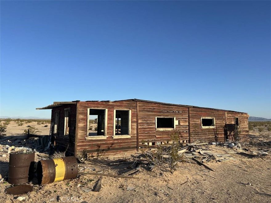 Ultimate Seclusion in the Desert Wilderness

One mile from your nearest neighbor, with vast BLM lands unfolding endlessly around you, where stunning 360-degree panoramas ignite infinite possibilities.

This rare, one-of-a-kind property stands ready to ignite your off-grid dreams.

Spanning 700 sq ft with FOUR spacious rooms, it could be the largest cabin in all of Wonder Valley!

Visionaries, Dreamers, and Pioneers Welcome
•Utopian Seekers: Escape to this hidden sanctuary, the perfect canvas for building your visionary, sustainable off-grid haven. 
•Water Independence Awaits: A proven, dependable water table at just 200 feet deep (buyer to verify). 
•360° Jaw-Dropping Vistas: Witness sunrises that paint the sky and sunsets that ignite the horizon. 

Location, Location, Location: Wonder Valley offers a unique blend of remoteness and accessibility:
•Joshua Tree National Park: Just 20 minutes away 
•Downtown Twentynine Palms: Only 15 minutes drive 
•Unbeatable Value: A neighboring 20-acre parcel boasting a luxury home is listed at $890k—seize this opportunity to claim far more land at a fraction of the cost!