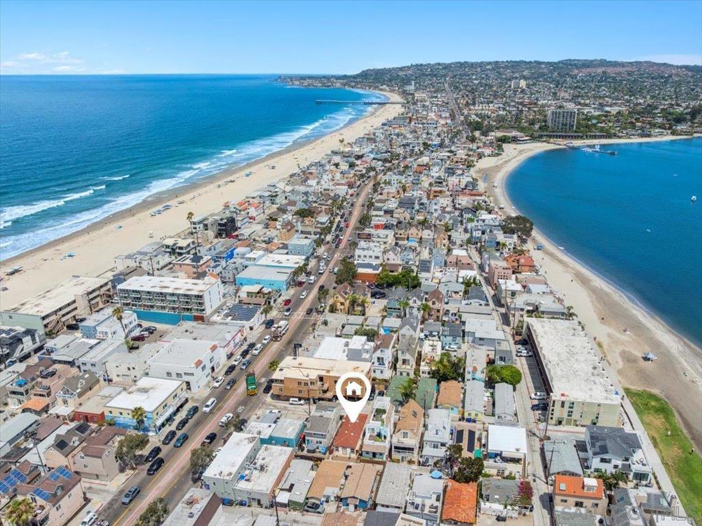 Live the beach life or invest in the perfect coastal geta-way with this charming duplex just a short walk to the ocean or the bay. This rare find offers two separate units ideal for full-time living, vacation rentals, or multi-generational living. The bright and breezy studio features a full bathroom with oversized soaking tub, efficient kitchen, and a breezy patio perfect for morning coffee or sunset cocktails. Ideal for guests, rental income, or your own personal beach retreat. The one-bedroom unit boasts a comfortable living space, full bath, and an open kitchen. With plenty of natural light and beachy vibes, it’s the perfect space for year-round living or extended stays. Whether you're looking for a smart investment, a second home, or a flexible living arrangement, this duplex delivers beachside charm and endless potential. Easy access to shops, dinning and Santa Clara Park with free public parking beach rental equipment, camps or lessons. Each unit has its own electric and gas meter; the water and sewer are shared. Both have air conditioning and heating.