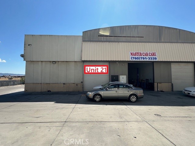 Multi-tenant mixed use Industrial Property has end cap space unit 21 (2000 sf). It has one ground level roll up door & warehouse space. Asking rent $2,000/month + utilities. Located in Industrial Zone area. Ideal for warehouse, auto repairs, etc. Paved road access.