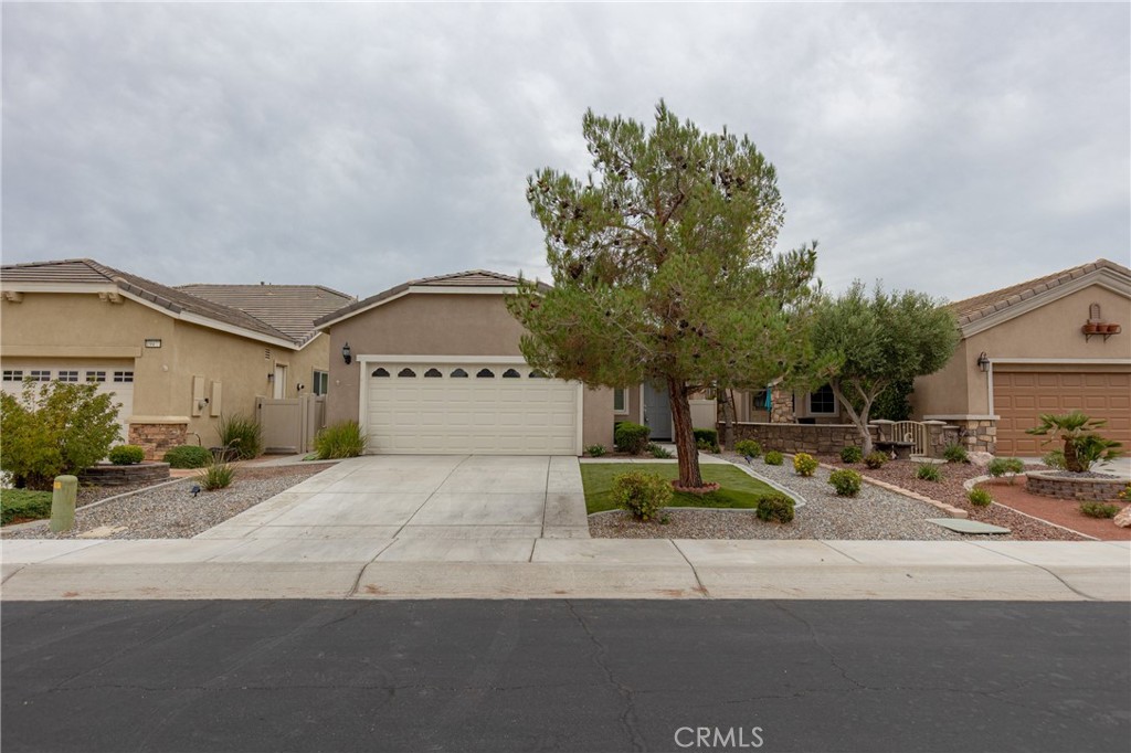 Welcome to Sun City Apple Valley, a premier 55+ community! This charming 2 bed, 2 bath home offers an open layout with a spacious living room, bright upgraded kitchen with plenty of counter space, and a cozy dining area. The primary suite includes a walk-in closet and private bath, while the guest bedroom is perfect for visitors or an office. Enjoy low-maintenance desert landscaping, a covered patio for relaxing outdoors, and a 2-car garage. Residents have access to resort-style amenities including clubhouses, pools, fitness center, golf, tennis, and walking trails. Conveniently located near shopping, dining, and healthcare. Move-in ready and waiting for its new owner—don’t miss this opportunity!