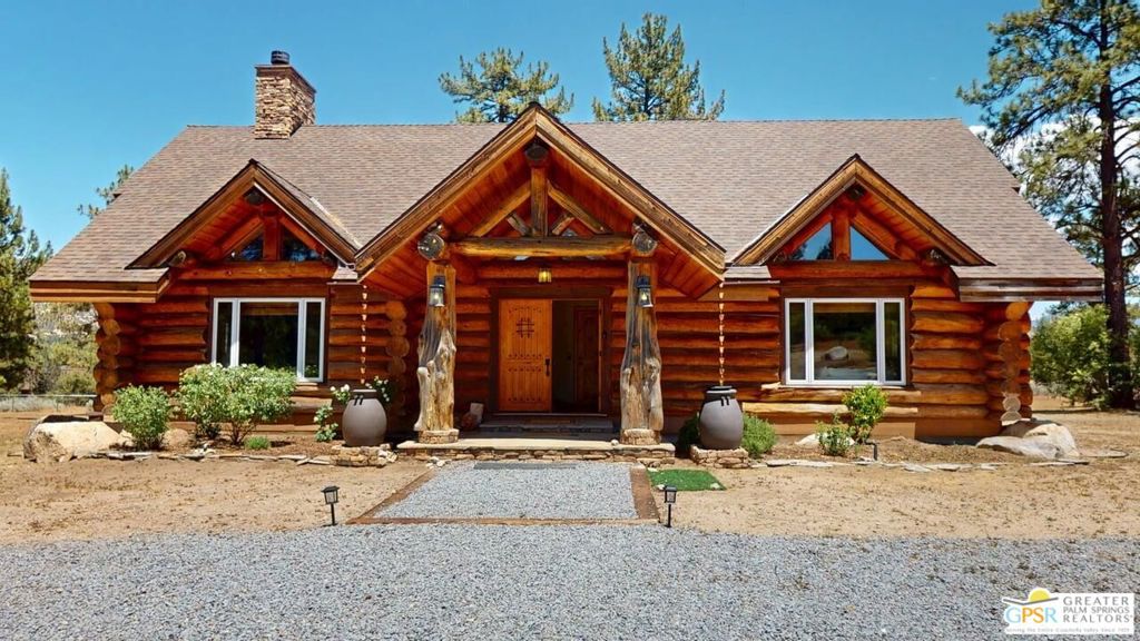 Majestic Mountain Views from this one-of-a-kind Log Home will be a special place for you to call home. Whether used for full-time residency or as a second home, the serenity of this open concept 4.5 acres, is sure to please the most discerning buyer. The Log Home includes a large entry foyer which sets the stage for all the interior spaces of this home. To the left of the entry is the large Great Room with wood burning fireplace, Dining area and Kitchen featuring a whimsical breakfast bar made entirely of a free form log - stunning! The two-story plus high ceilings and the use of the natural log walls lend themselves to the unique character of this special residence. The Great Room is light and bright just perfect for both intimate gatherings or large-scale parties. The views of the mountains in the distance are incredible. The kitchen features granite counters with custom designed backsplashes that depict the mountains - very clever - plus the new electric range/oven, pot-filler and vent hood, double door refrigerator, microwave oven, dishwasher and a semi-hidden pantry closet under the stairs to the loft complete the open kitchen. There is a free form log bar in the corner of the Great Room as well. To the right of the front door is access to the large Primary First Floor Suite with extremely high ceilings and a ceiling fan and access to the combination dressing room/spa room and then on to the primary ensuite bath. The stall shower has beautiful stone work. The double vanity, with granite counters, is great as well. The views from the bathroom and primary suite are exquisite, as they are from the other rooms in this well designed home. The dressing/spa room offers direct access to the north facing deck with room for outdoor entertaining and the outdoor spa, just a few steps away. At the other end of the home, the French doors off the Great Room lead to the first floor bedroom, which could also be used as an office or study. This room also offers access to the north facing deck. Besides the first floor bathroom - with the stackable laundry closet - up the stairs is the additional lofted bedroom - extremely light and bright featuring lovely views to the north. The property is well maintained with pastures for a myriad of uses and the electronically operated iron gate sets the stage for what awaits owners and visitors to this massive property. Located within a 45 minute drive to Palm Desert - El Paseo - shopping and dining and the property is about a 25 minute drive to Idyllwild/Pine Cove. The Paradise Valley Cafe, at the corner of Hwy 371 and Hwy 74 is a great dining location just a few miles to the east of the property. The community has it's own clubhouse known as the Garner Valley Property Owners Association also located on Devils Ladder Road. Easy to show. Welcome to your new Mountain Home!