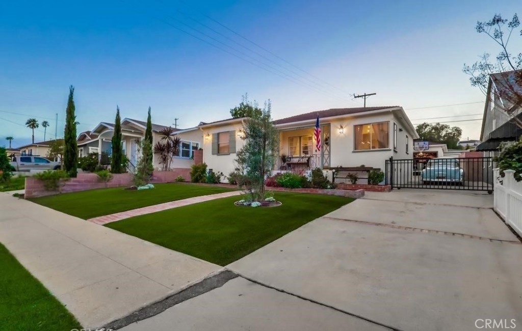 Charming 3 Bed, 2 Bath Cottage in upper Vista Del Oro – Modern Upgrades + Classic Charm! Available Sep 1st, or possibly sooner.
Welcome home to this stunning 1940s San Pedro cottage, full of character yet thoughtfully updated for today’s lifestyle! Located in the desirable Vista Del Oro neighborhood, this 3 bedroom, 2 bathroom home offers the perfect mix of vintage charm and modern comfort. Step onto the inviting covered front porch, framed by vibrant landscaping and lush artificial turf — the perfect spot for morning coffee or evening relaxation. Inside, you’ll love the open-concept living area featuring a bright and airy flow between the living room, remodeled kitchen, and dining nook. The heart of the home is the gorgeous kitchen, complete with custom cabinetry, large center island with breakfast bar, stone accent wall, quartz countertops, stainless steel cooktop and oven. Beautiful wide-plank French Oak-style laminate floors run throughout, combining style with easy maintenance. Down the main hallway, you’ll find two generously sized secondary bedrooms and a full bathroom with a jetted tub, pedestal sink, and built-in linen cabinetry. The spacious primary suite offers a private ¾ bath, a newly installed custom closet system, and convenient in-suite laundry. The backyard is designed for both fun and relaxation, featuring a covered patio with bistro lights and a turf play area — perfect for entertaining, birthday parties, or simply unwinding after a busy day. Additional features include: Refrigerator, dishwasher, washer and dryer. Central heating and air conditioning. One-car detached garage + driveway parking for 3–4 vehicles. Prime location in one of San Pedro’s best micro-climates. Close to parks, schools, shopping, dining, and easy freeway access. Don’t miss your chance to live in this stylish and move-in-ready home! Property is virtually staged.