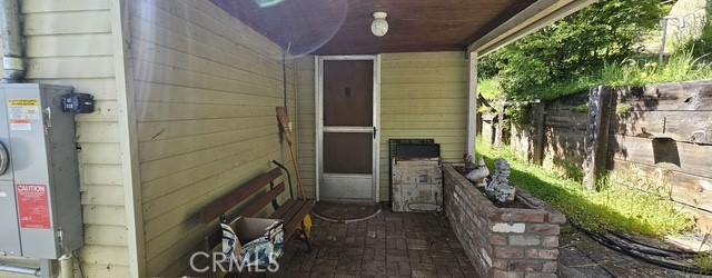 What a delightful lakefront home! Seller has had wonderful memories in this vacation home. Large dock and patio area on the waterfront. Ramp to pull in wave runner. 1 BD and 1 BA upstairs and 2nd BD downstairs. Pellet stove in living and dining room area. Workshop downstairs. Newer metal roof with solar panels that are leased. Carport area too.