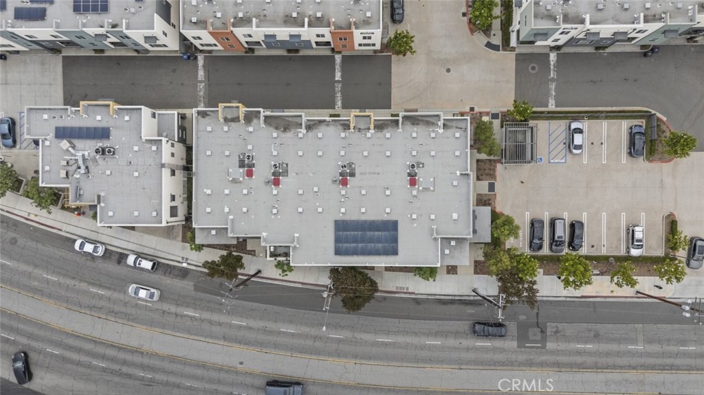 Now available in the heart of Bellflower—this sleek and modern commercial office suite offers approximately 900 square feet of functional, high-visibility space ideal for a wide range of professional or creative uses. Positioned on the ground level for easy access and daily exposure, the unit features floor-to-ceiling windows, polished interiors, and a well-designed layout that includes multiple enclosed offices, a conference area, and open workspace potential. Thoughtfully built out with glass partitions, contemporary flooring, high ceilings, and recessed lighting throughout, the space provides a turnkey environment for owner-users or investors alike. Situated in a well-maintained mixed-use complex with street frontage and signage visibility. Minutes from major corridors, freeways, and surrounding retail amenities. A must-see for those looking to establish or expand in a prime Bellflower location.