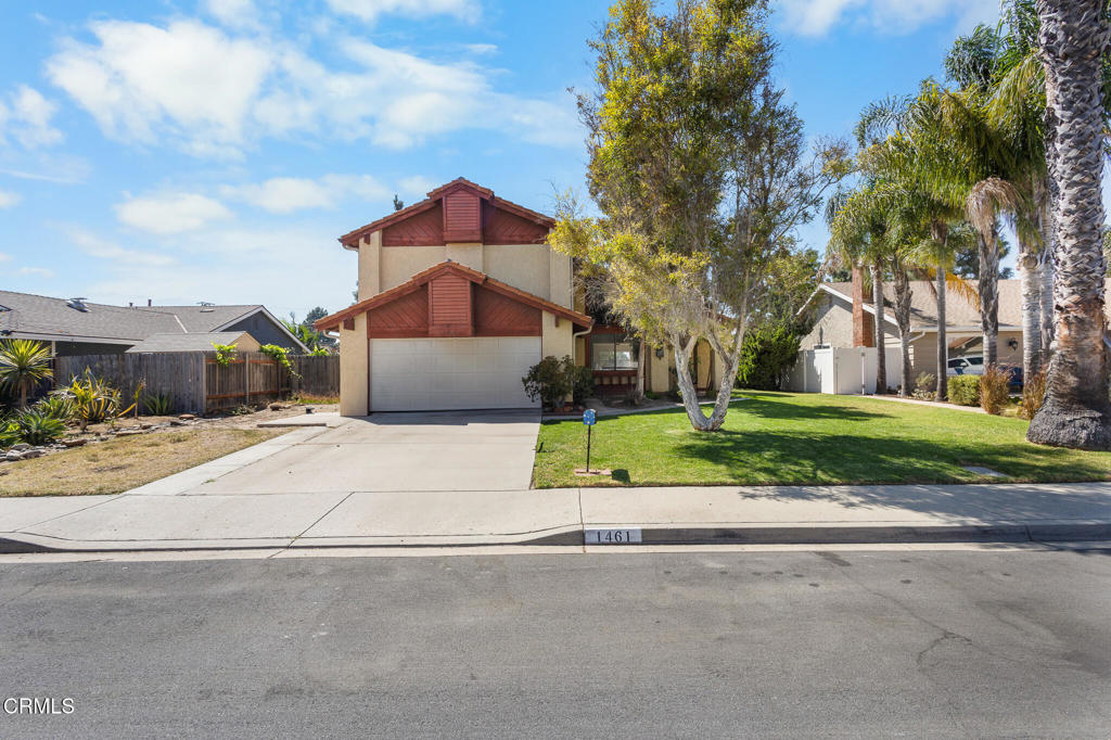 Welcome to this spacious 4-bedroom, 3-bath, two-story home in desirable Parkwood Estates. Perfectly situated near shopping, dining, parks, and with easy freeway access; this residence offers both comfort and convenience.Step inside to a bright living room with soaring cathedral ceilings, creating an open and airy feel. The family room features a cozy fireplace and sliding patio doors that lead to the backyard--ideal for entertaining. A first-floor bedroom and full bath provide flexible living options for guests or multigenerational needs.Upstairs, the primary suite boasts a private ensuite bath and walk-in closet, offering a relaxing retreat. Flooring throughout the home includes a mix of tile, wood laminate, and carpet. This property is an excellent opportunity to bring your personal touch to make it truly your own.