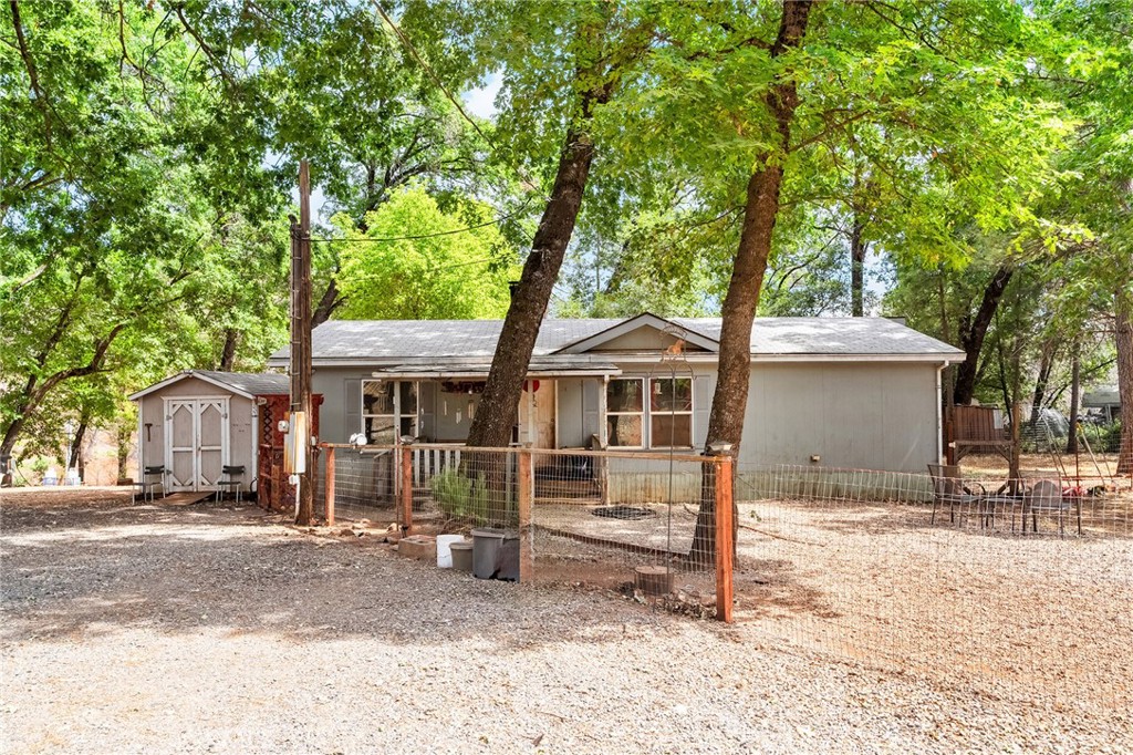 Nestled on just under two acres of serene land, this 3-bedroom, 2-bathroom home offers the mountain retreat you've been dreaming of. Surrounded by majestic oak and pine trees, this property boasts unparalleled tranquility in the welcoming community of Cohasset. Located in the picturesque foothills, it's just a short, scenic drive from Chico, CA, offering the perfect blend of secluded living with convenient access to urban amenities. This home presents a wealth of potential, providing ample space for horses, chickens, and all your rural aspirations. Imagine unwinding by the soothing sounds of Maple Creek, which gracefully meanders through the back of the property. Embrace the community spirit of Cohasset, complete with a general store, community center, church, and local fire station. The community center is a hub of activity, hosting 4-H programs, mountain music events, an annual bazaar, a lively chili cook-off, community safety meetings, and much more. As a FireWise community, Cohasset also offers the added benefit of potential savings on your homeowners insurance. Don't miss this opportunity to create your peaceful mountain sanctuary!