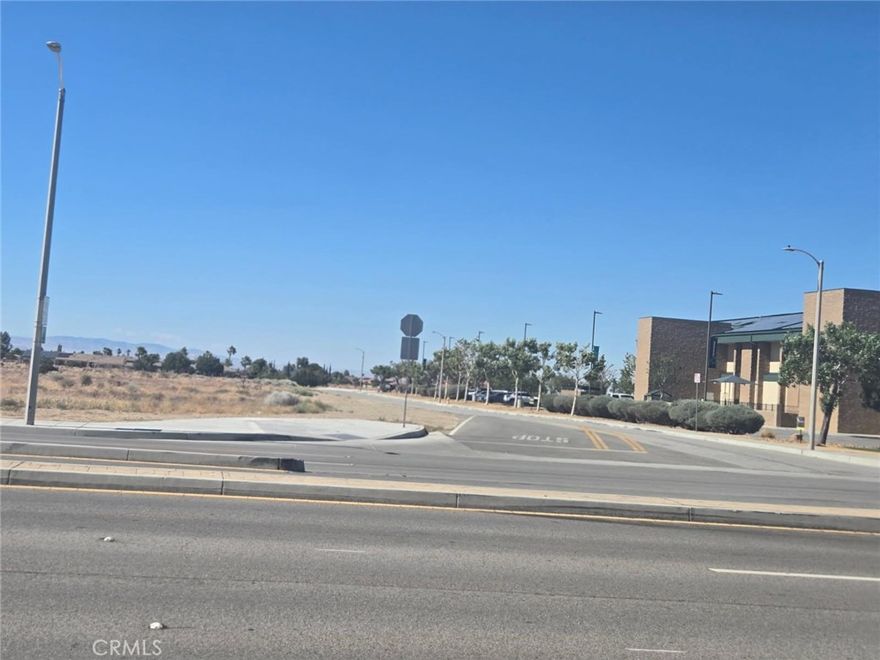 Prime Development Opportunity-Corner of 21st Street West & Rancho Vista Blvd in Palmdale offered at $2,100,000.00. Incredible opportunity to own a high visibility corner lot located at the intersection of 21st West and Rancho Vista Blvd in one of Palmdale's most desirable growth areas. The raw nearly 2-acre parcel offers dual zoning for both residential and commercial use (buyer to verify corner lot designation and zoning with the city). Strategically positioned near the Antelope Valley Mall, major shopping centers, popular restaurants and just minutes from the Palmdale Amphitheater and Marie Kerr Park, this location offers unmatched accessibility and exposure. Key Features: Corner location at a major intersection. Approved for residential and commercial development (buyer to verify). Surrounded by retail, restaurants, and entertainment. Close to the Antelope Valley Mall and Rancho Vista Golf Course. Minutes from schools, transit and freeway access. Water main present on 21st Street West. High-traffic area with strong development potential. Whether you're looking to develop a retail center, mixed-used project, or housing, this lot is situated in a rapidly growing part of Palmdale, making it a smart long-term investment. Don't miss this rare opportunity to secure land in one of the Antelope Valley's most active corridors.