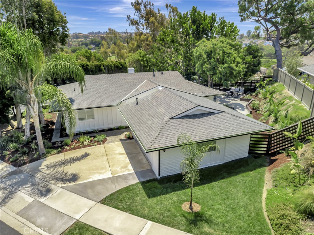 Location, Location, Location! Just three miles up Niguel Road from the iconic Salt Creek Beach and Monarch Beach coastline, this home enjoys a prime Laguna Niguel setting with rolling hills, cool coastal breezes, and a temperate climate.
Why You'll Love It:
This private lot offers expansive outdoor living with a spacious patio, mature trees, lawn, and thoughtfully designed garden beds—perfect for relaxing or entertaining. Nestled in a welcoming neighborhood with great neighbors, this home exudes warmth and charm.
Interior Highlights:
Featuring a light and neutral color palette, the open floor plan is both stylish and functional. The chef-inspired kitchen boasts brand-new GE stainless steel appliances, white shaker cabinetry, a marble backsplash, and a large quartz center island with seating for five and additional built-in storage. Don’t miss the custom Coffee Bar—a daily delight!
Living & Dining Spaces:
The inviting living room is anchored by a cozy fireplace with a rustic wood mantel. A generous dining area opens to the backyard via elegant French doors, creating seamless indoor-outdoor flow. Near the front door, a smartly designed drop zone keeps daily essentials organized.
Additional Features:
• Oversized finished garage with cabinetry and workshop space—ideal for cars, hobbies, or a home gym
• Inside laundry closet for added convenience
• Dual-pane windows for cross ventilation
• Easy-care landscaping with sprinklers, gravel drainage areas, and seamless aluminum gutters
• Fire-resistant Hardie siding recently installed
• Single-level layout with no interior steps
Prime Accessibility:
Minutes from the 5 Freeway, Pacific Coast Highway, and the 73 Toll Road. Just 30 minutes to John Wayne Airport and about an hour to LAX or San Diego. Close to world-class resorts like the Ritz-Carlton, Waldorf Astoria Monarch Beach, The Ranch, and Montage Laguna Beach.
Lifestyle Perks:
Enjoy nearby golf courses, Dana Point Harbor, the Ocean Institute, Laguna Niguel Regional Park, sports complexes, and miles of hiking and biking trails.
This home has amazing energy—you’ll feel it the moment you walk in. Come see why you’ll love living here!