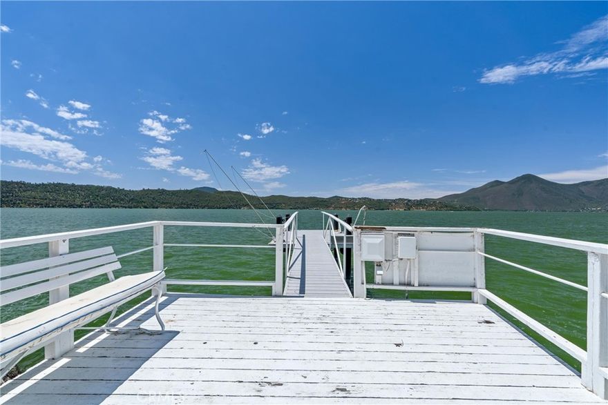 Enjoy panoramic views of Clear Lake and Mount Konocti from this stunning two-story residence! This unique property offers flexible living options-ideal for full-time living, vacation getaway, or income generation. Each level features its own fully self-contained living space with its a private entrance, upstairs unit 3 bedrooms 1 bathroom, downstairs unit 2 bedroom 1 bathroom. Relax in the hot tub, enjoy the convenience of a private  electric dock, and feel like you are in vacation year round. Spacious parking,including space for a boat, RV or both. Don't miss this rare opportunity!
