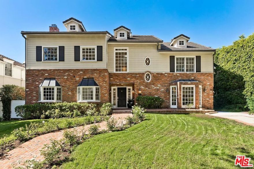 Situated on totally flat lot on one of Little Holmby's most coveted streets, this is the remodeled Traditional home everyone has been yearning for.  The house, built is 1931, has been extensively remodeled and updated with newer system buts retains all the cherished original detail work of crown moldings, warm hardwood floors, wainscoting, chair rails and numerous French doors throughout the house. It boasts a classic floor plan with a large formal living room with stately fireplace, inviting formal dining room with bay windows, gracious den/office with wet bar and large convivial family room opening to breakfast room and kitchen. The spacious gourmet kitchen is designed for the most seasoned or aspiring chefs featuring marble counters, high-end stainless appliances, large pantry and large center island. All four bedrooms, each with its own ensuite bath, are upstairs including a palatial primary suite boasting a large sitting area, glorious fireplace, French doors opening to a balcony overlooking the rear garden, generous dual closets and a sumptuous step-down marble bath with separate soaking tub and shower.  The rear of the house opens to a private garden with mature landscaping featuring brick patio, grassy area and spa. Most importantly the yard also has an unheard of 525 SF of covered living area creating the perfect space to enjoy the quintessential outdoor California lifestyle of year-around outdoor parties, football/sports viewing events and alfresco dining under the stars.  In addition, the house has a large 558 SF ADU featuring sitting area bedroom and spacious bath befitting even the pickiest of house guests. Coupled with its classic and modern features, the home is mere moments from the award-winning Warner Avenue elementary School, relaxing atmosphere of Holmby Park, the world-class shopping at Westfield Century City, the glamour of Beverly Hills, and the cultural offerings of UCLA and Westwood. This is a great opportunity to own one a move in ready house on one of the most prestigious streets in the neighborhood.