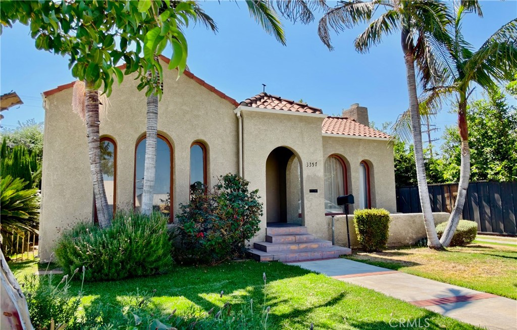Gorgeous turn-key Spanish style home in a convenient location. Bright and pleasant, this home features a spacious open floor plan. Upgraded quartz countertops in the kitchen with stainless steel appliances and leads to a spacious breakfast nook, dining room and a lovely deck/patio. Other features include a NEST thermostat control, recessed lighting, newer central air and LVP in the master bedroom + refinished hardwood floors and a separate laundry room with washer and dryer. Ample parking is provided with a two-car garage, long gated driveway and a fenced backyard. Easy access to the 10 FWY makes this one of the most convenient locations in the city. A great home, ready to move in.