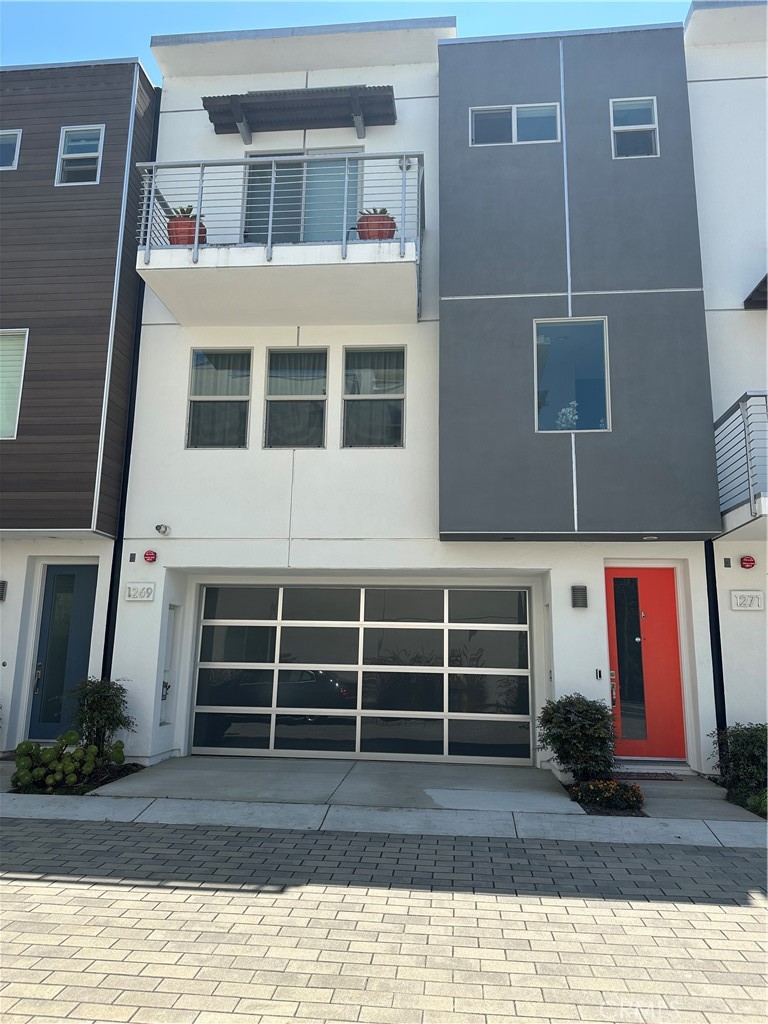 Welcome to this highly desirable community of Westreef in Costa Mesa. This single family home features a blend of contemporary design and luxurious amenities. There are 3 bedrooms (all upstairs) 2 bathrooms and 2 half bathrooms. This home is the epitome of comfortable and stylish living. The first floor has high ceilings that create an airy and inviting ambiance. The heart of the home is the chef's kitchen, with stainless steel appliances which includes a Dacor refrigerator. The kitchen has quartz countertops, stone backsplash and white cabinets. Step outside on the back patio you'll find a cozy custom fireplace with nicely maintained landscaping. In the garage you'll find eco-friendly home that comes with a Tesla charging station, fully paid solar panels, a tankless water heater, air conditioning and dual pane windows. There is an office and laundry room in the garage which holds two cars.
